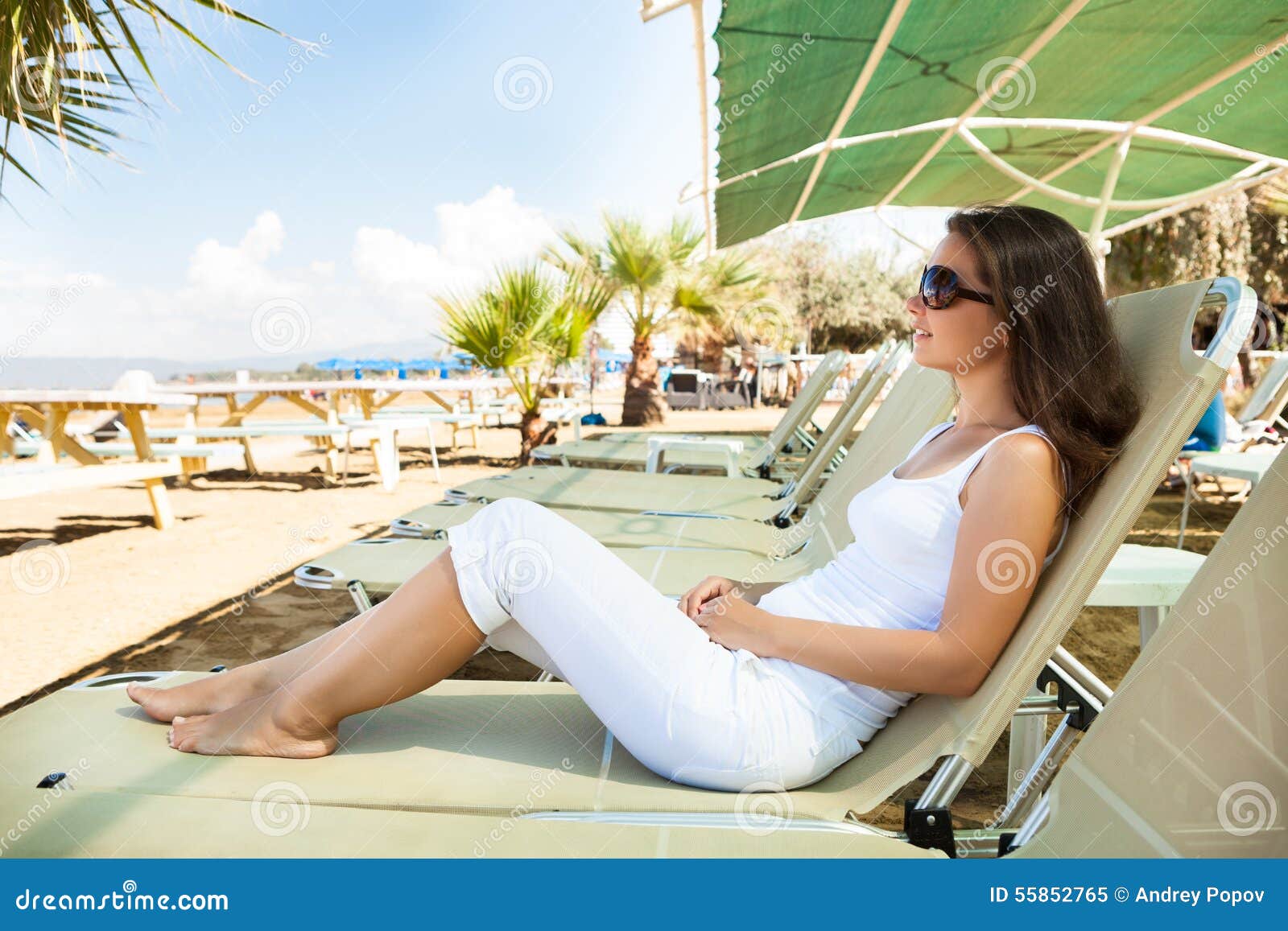 Woman Relaxing On Lounge Chair At Beach Stock Image Image Of Full