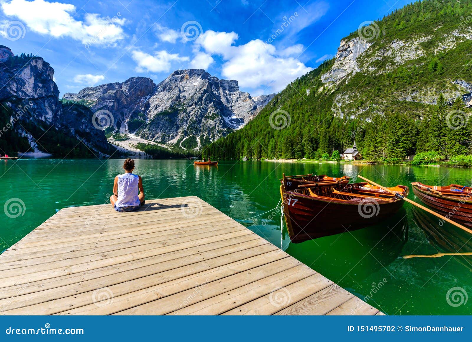 Woman Relaxing on Pier at Lake Braies Also Known As Pragser Wildsee in ...