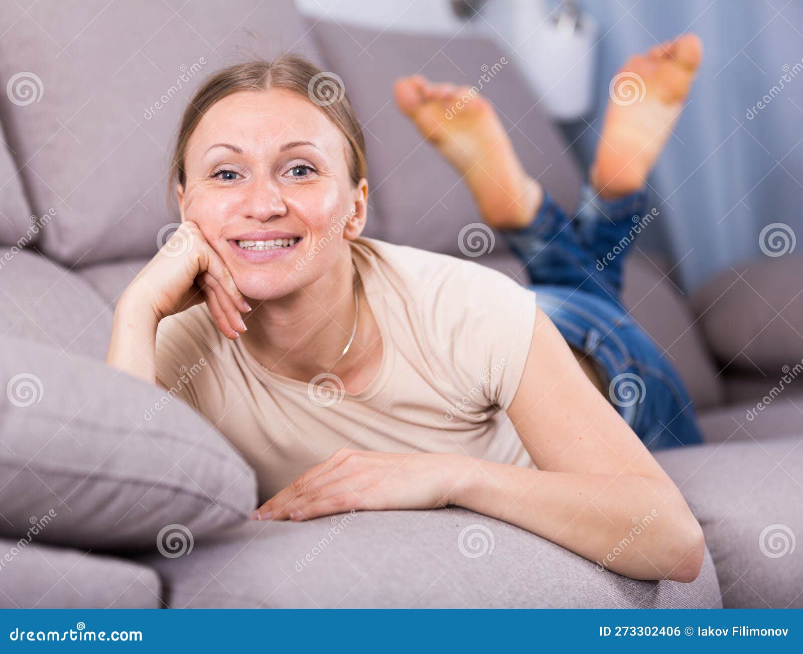 Woman relaxing on sofa stock photo. Image of caucasian 273302406