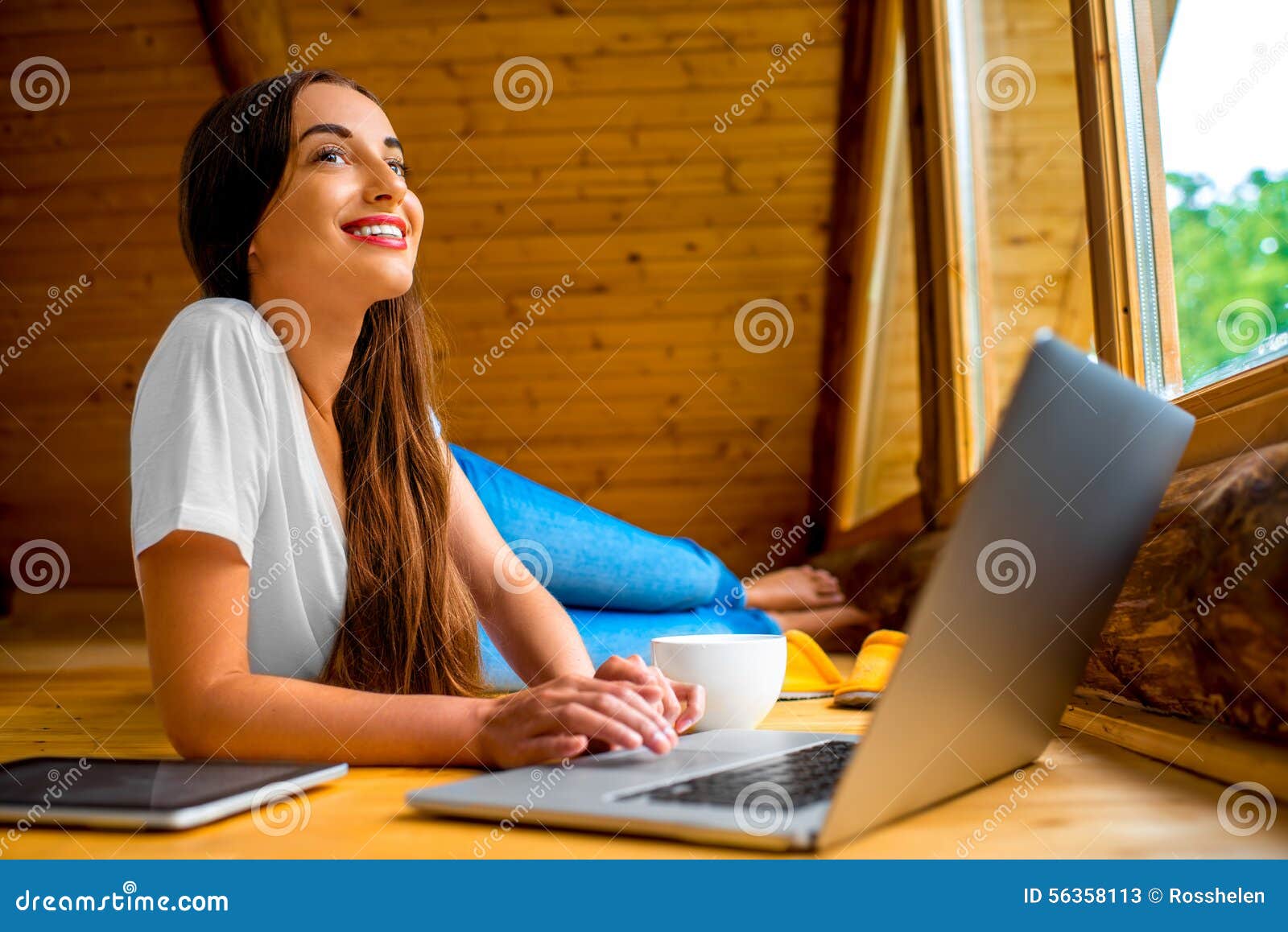 woman relaxing in wooden house