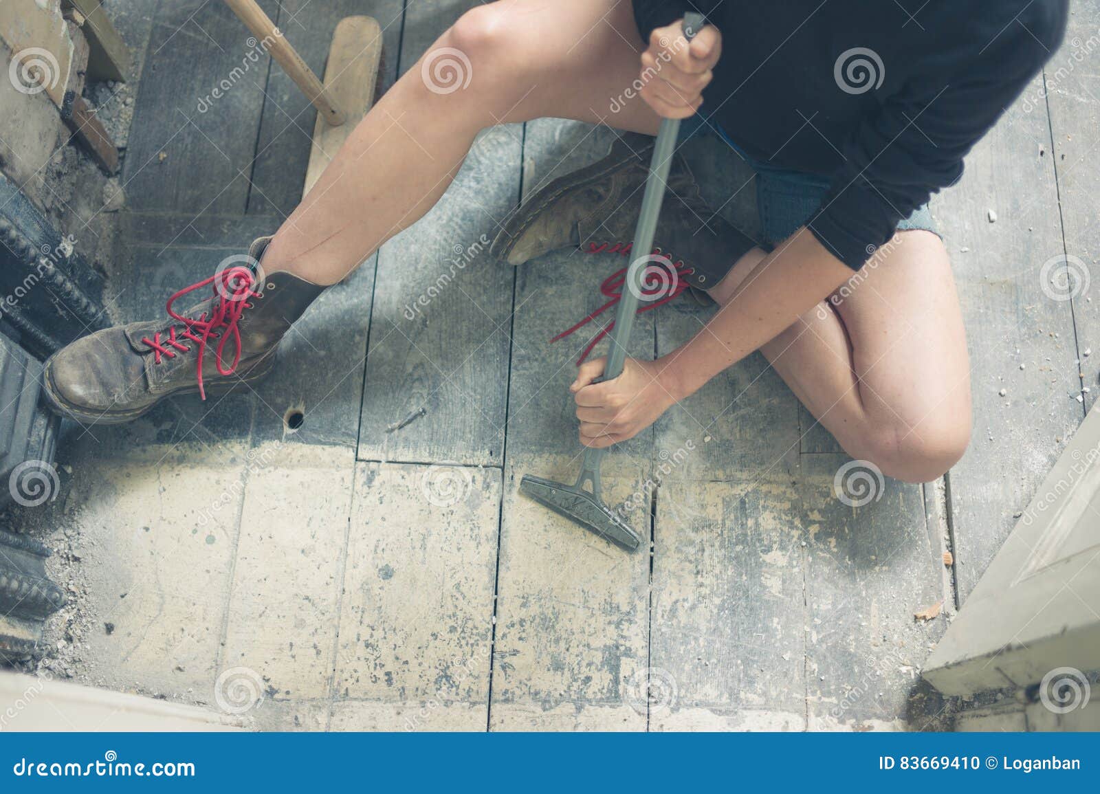 Woman Removing Paint From Floorboards Stock Photo Image