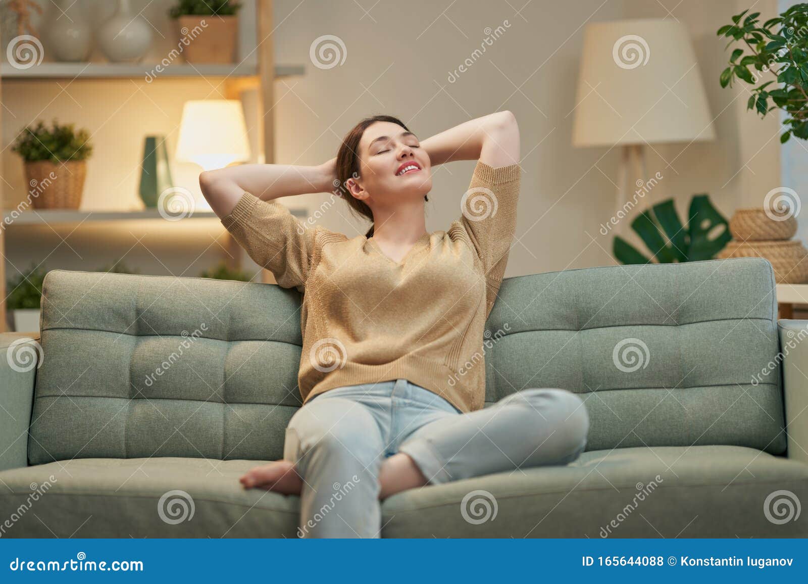 woman resting on sofa