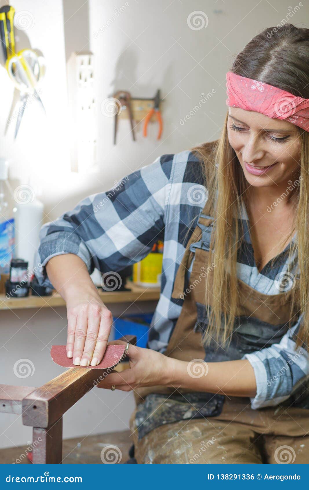 Woman Restoring Furniture in a Stock Photo Image of