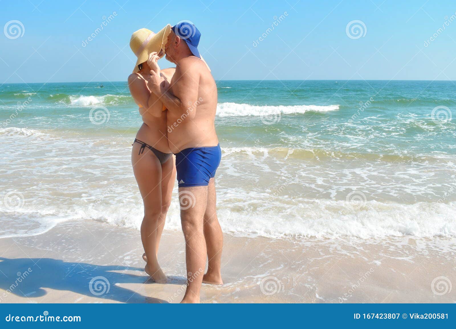 girl and two guys at the beach