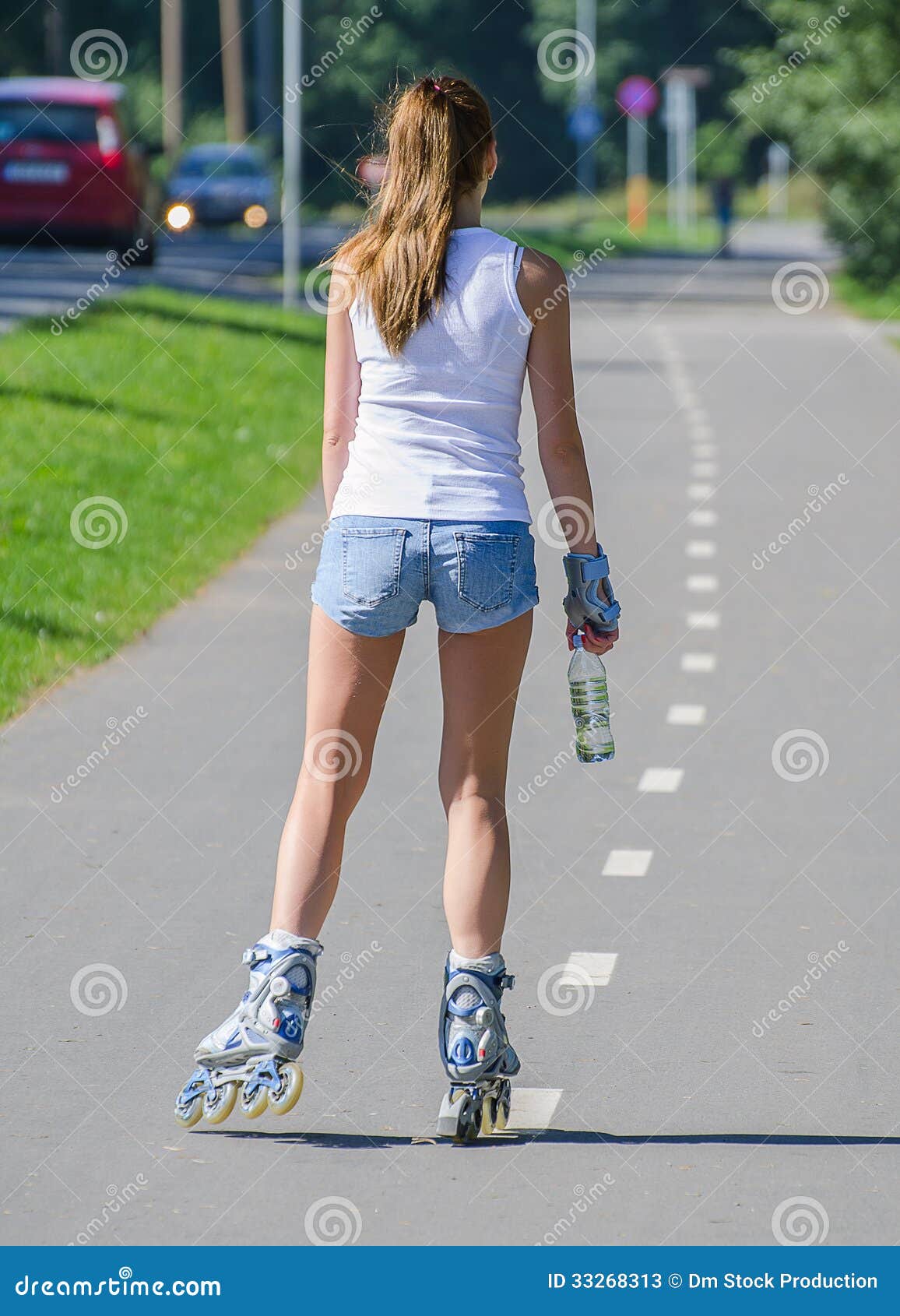 Woman Ride Rollerblades in the Park. Back View. Stock Image Image of