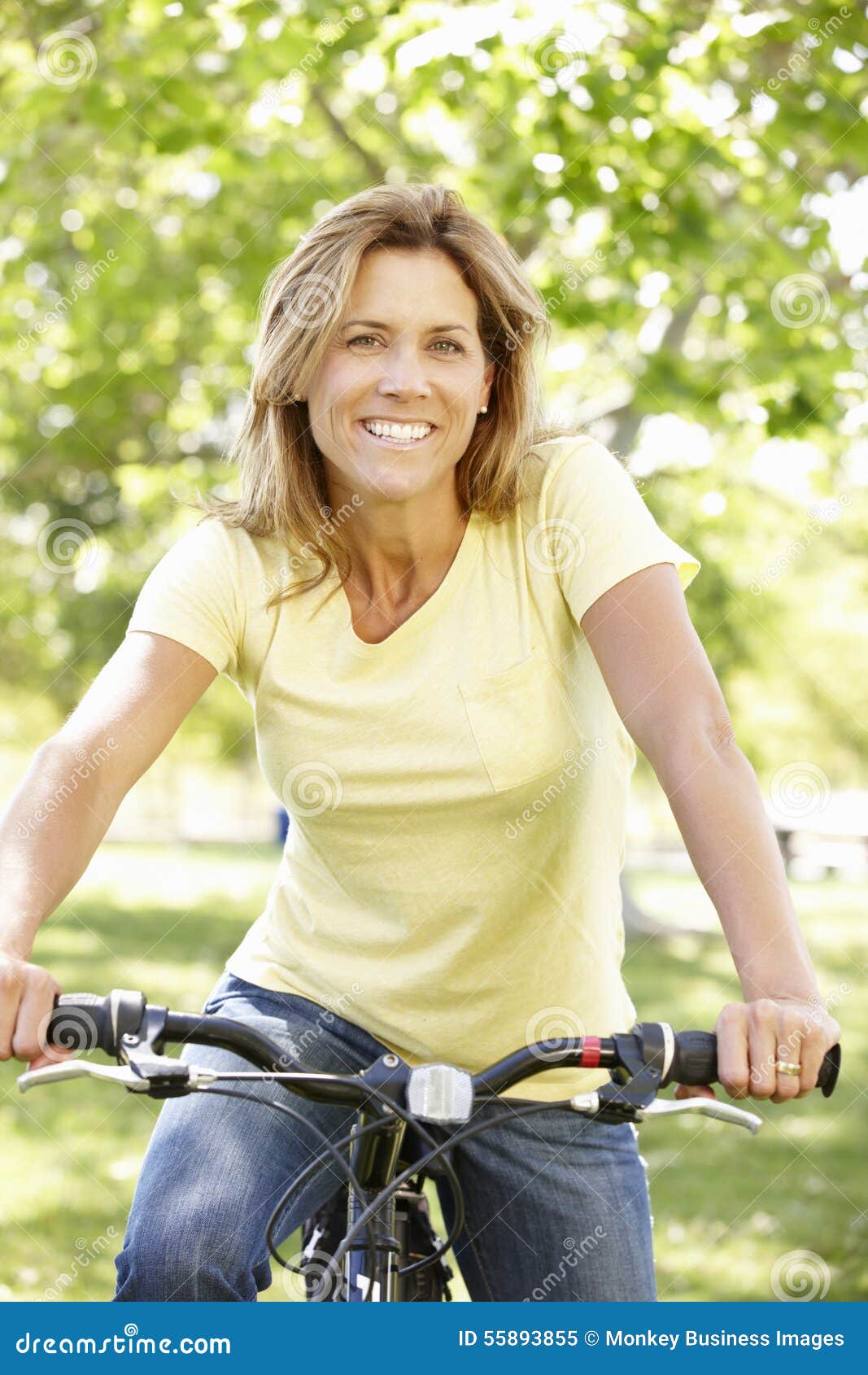 Woman riding bike stock image. Image of lifestyle, country 55893855