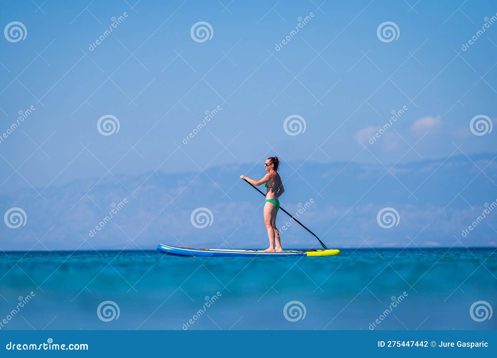 Woman Riding SUP Stand Up Paddle on Vacation Stock Photo - Image of ...