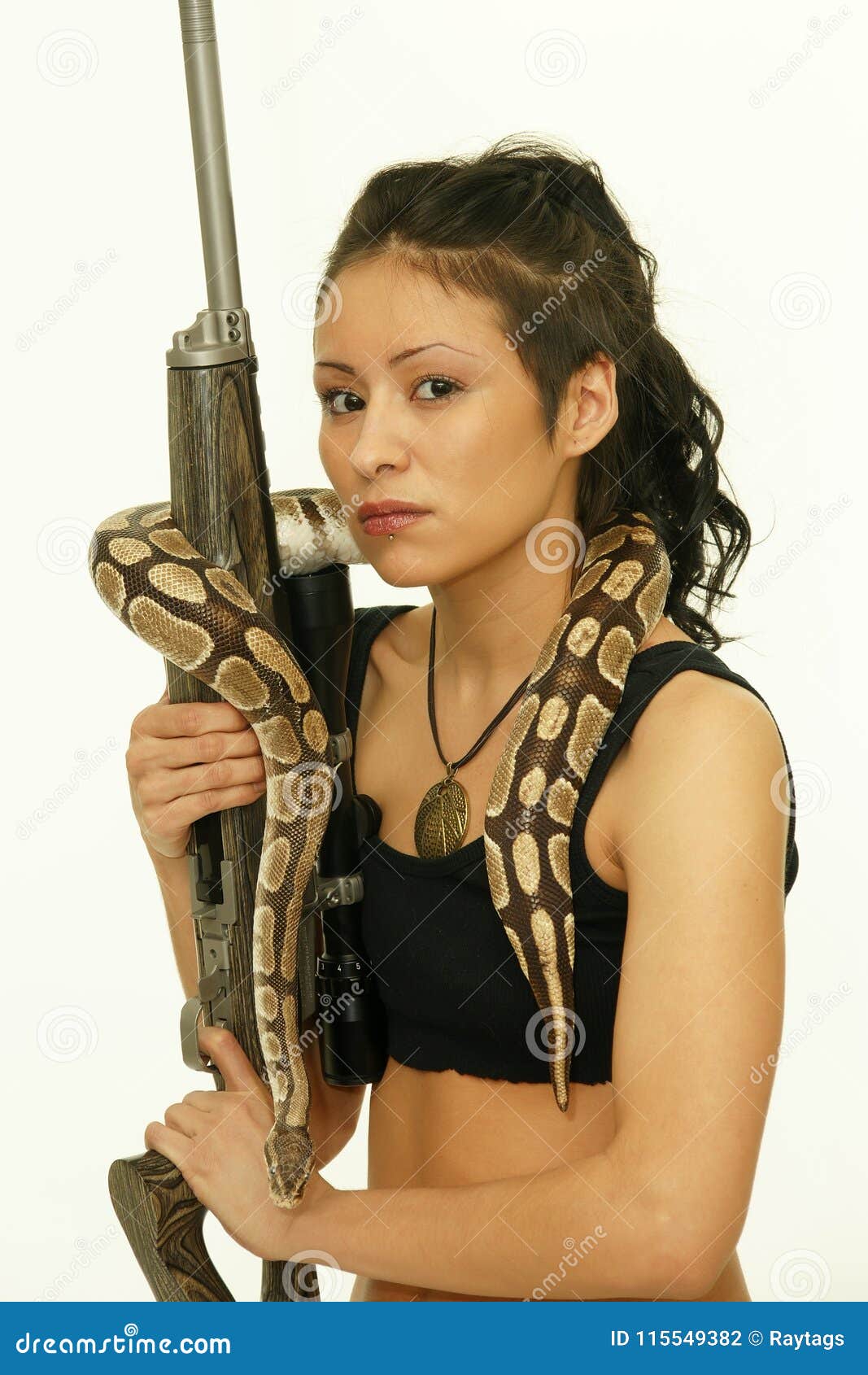 Woman with rifle and snake stock photo. Image of amphibian - 115549382