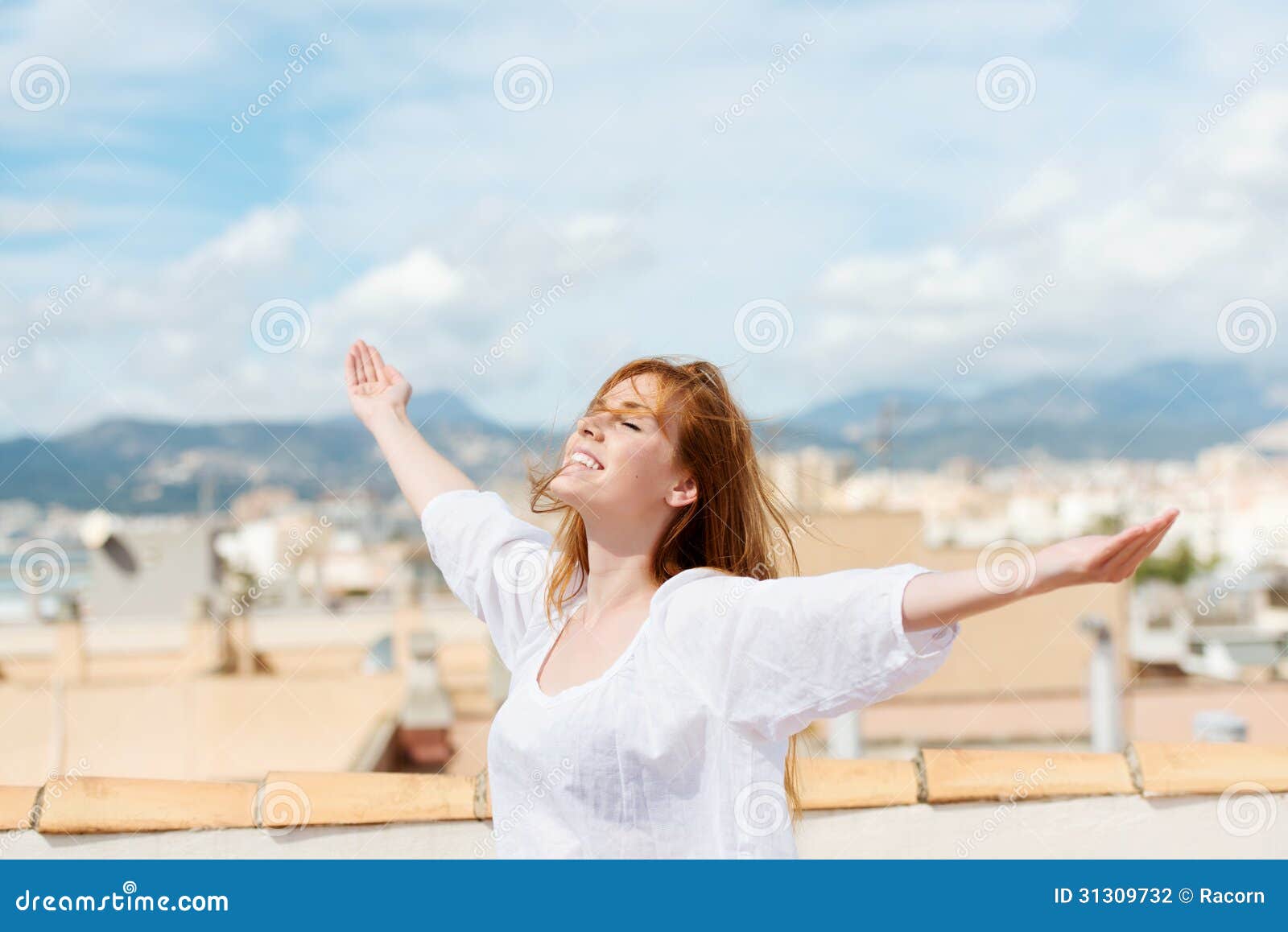 Woman on a Rooftop Embracing the Sunshine Stock Photo - Image of relax