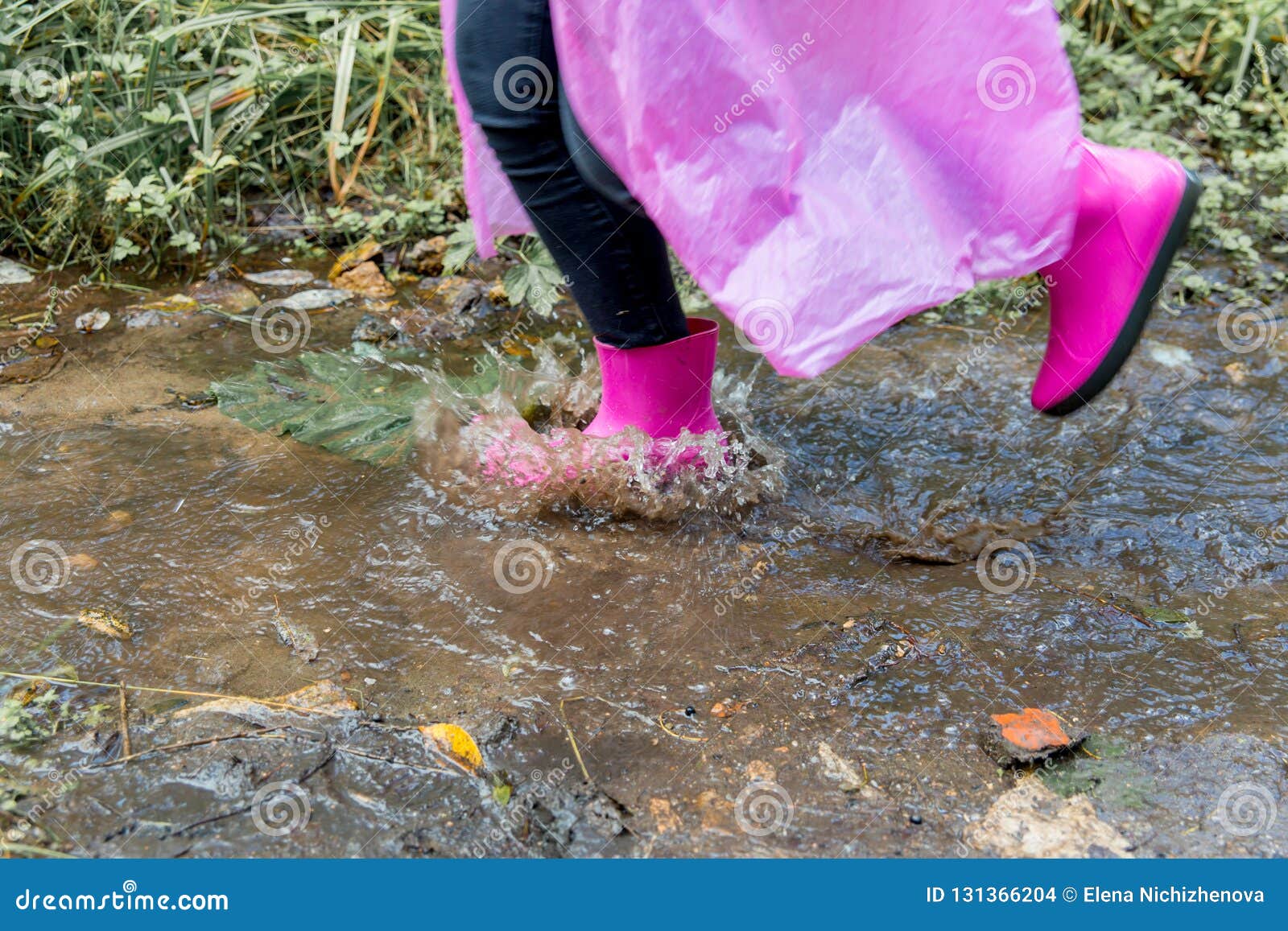 Young Children Playing In A Mud Puddle Stock Image - Image 