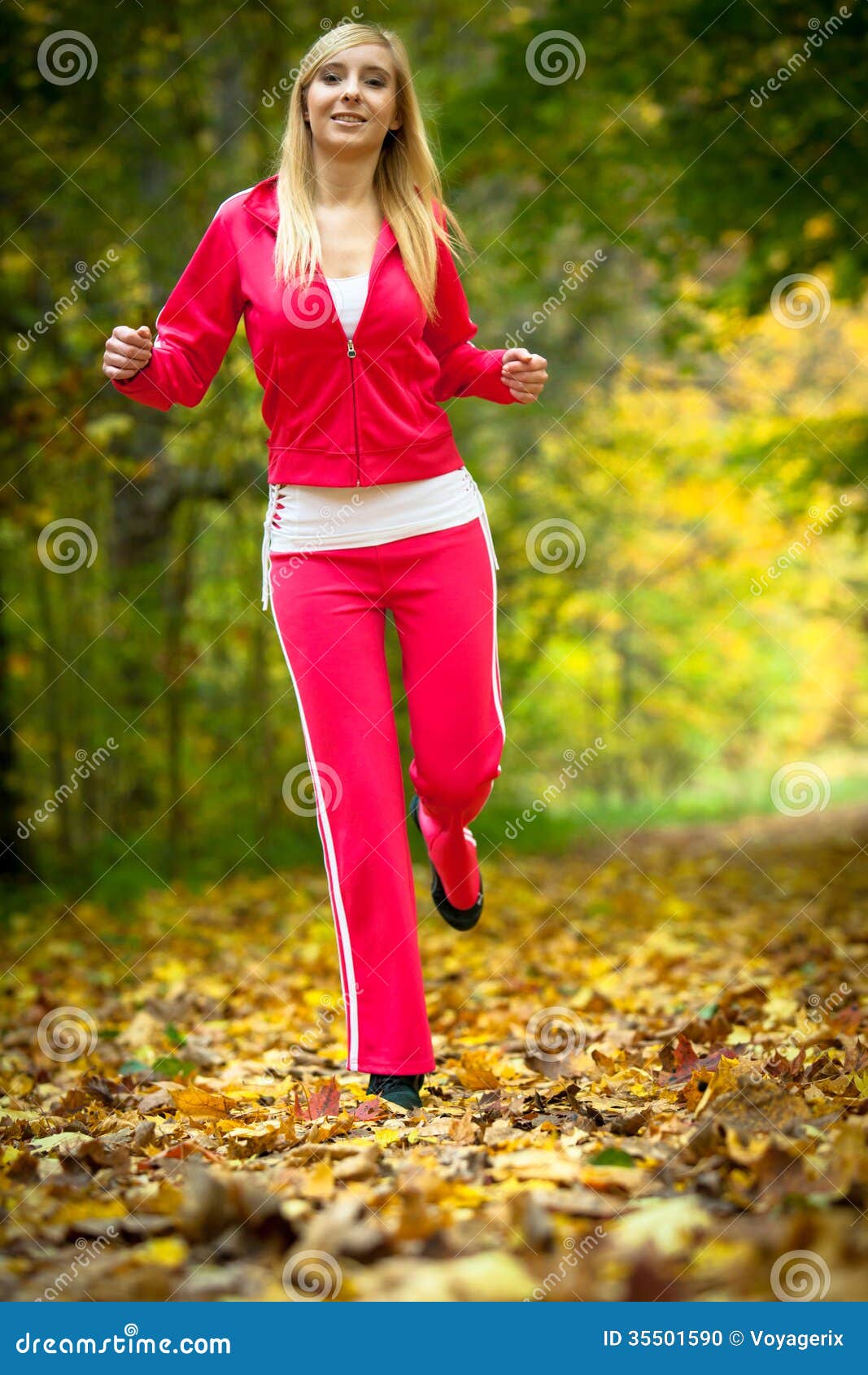 Woman Running in Autumn Forest. Female Runner Training. Stock Photo ...