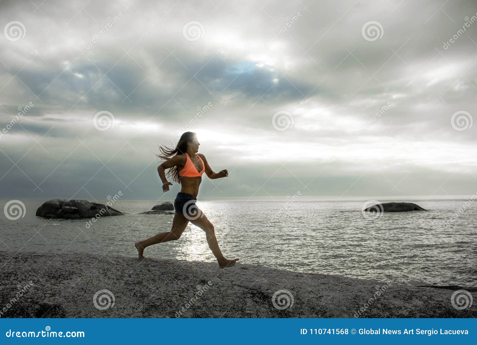 Woman Running On A Rock At Sunset On Bakovern Beach Cape Town Stock Photo Image Of Dusk