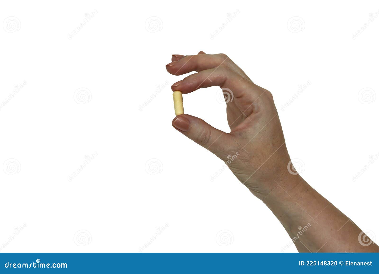 a woman`s hand holding a pill capsule, 