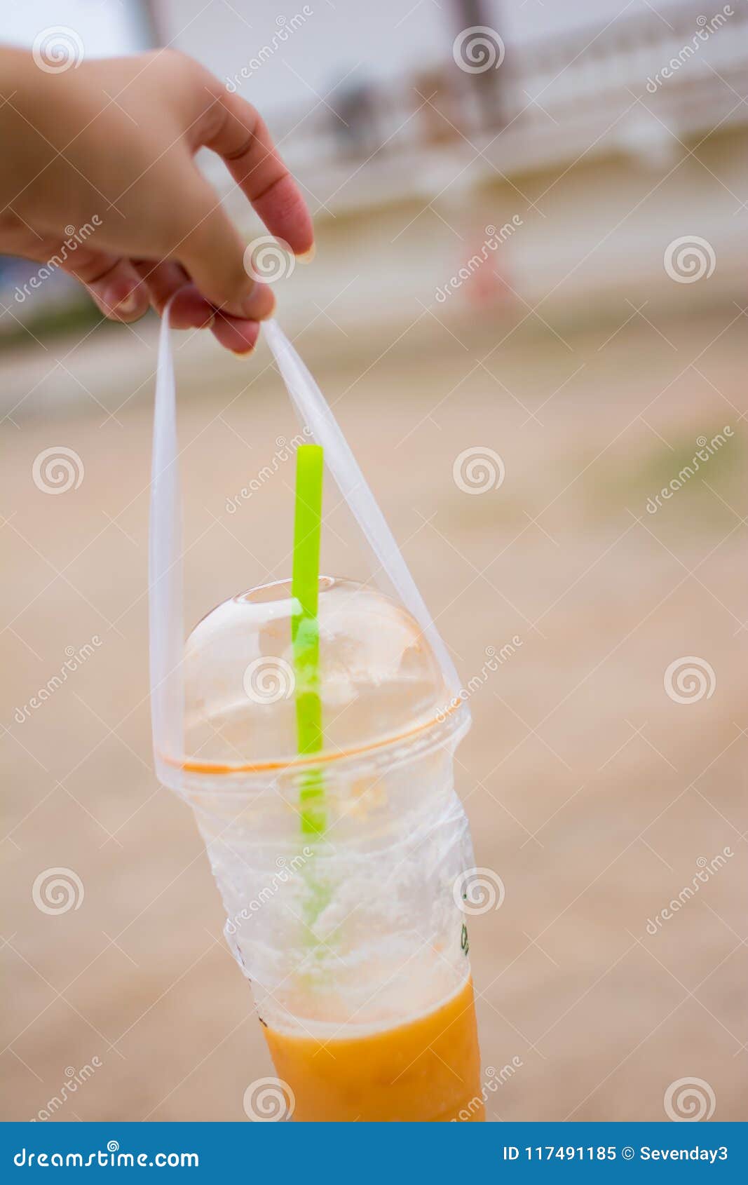 The Woman`s Hand is Holding a Plastic Cup of Thai Tea, Picture in ...