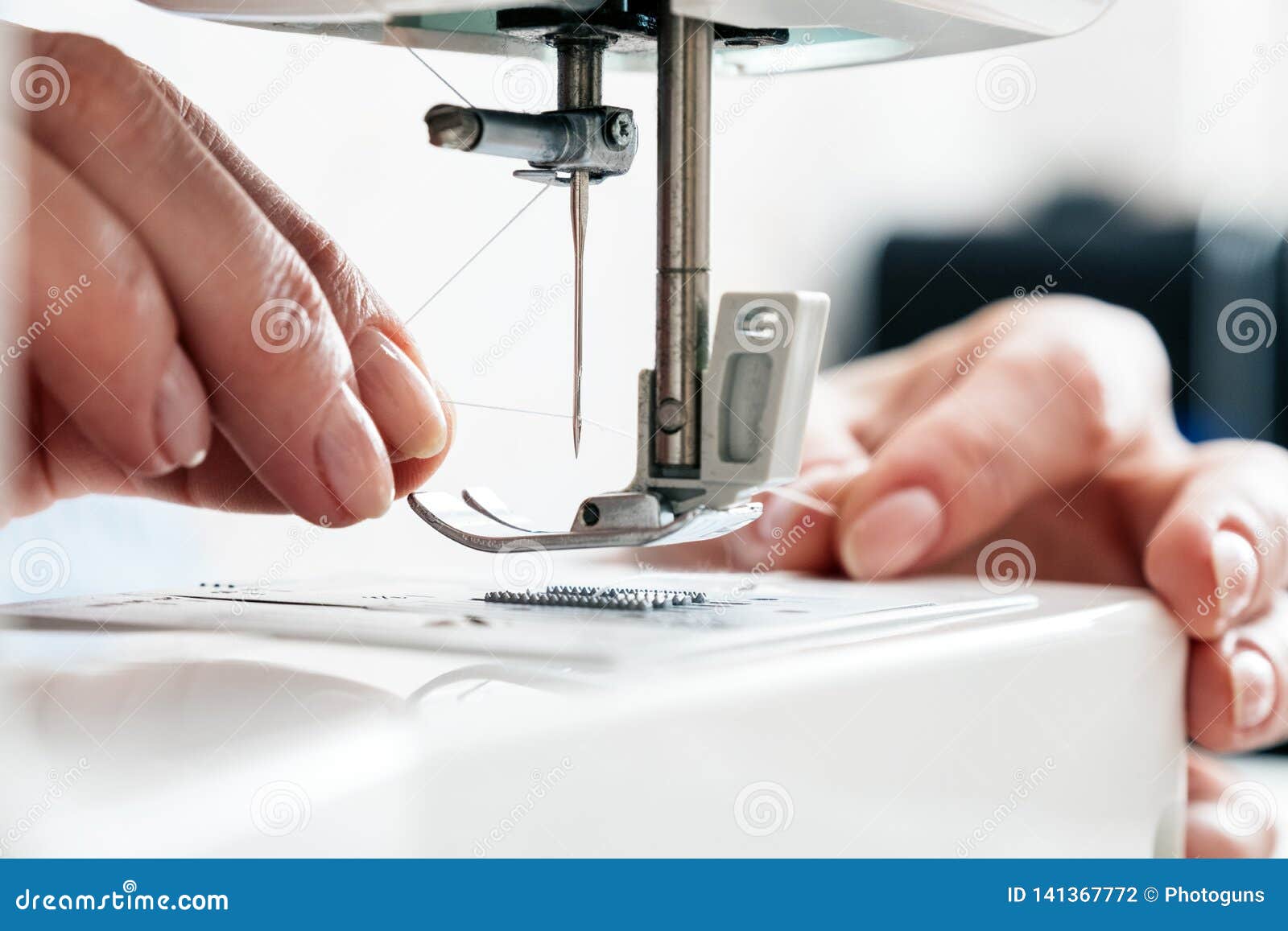 Thread and Threading a Sewing Machine Needle Stock Photo Image of houseworker, needle 141367772