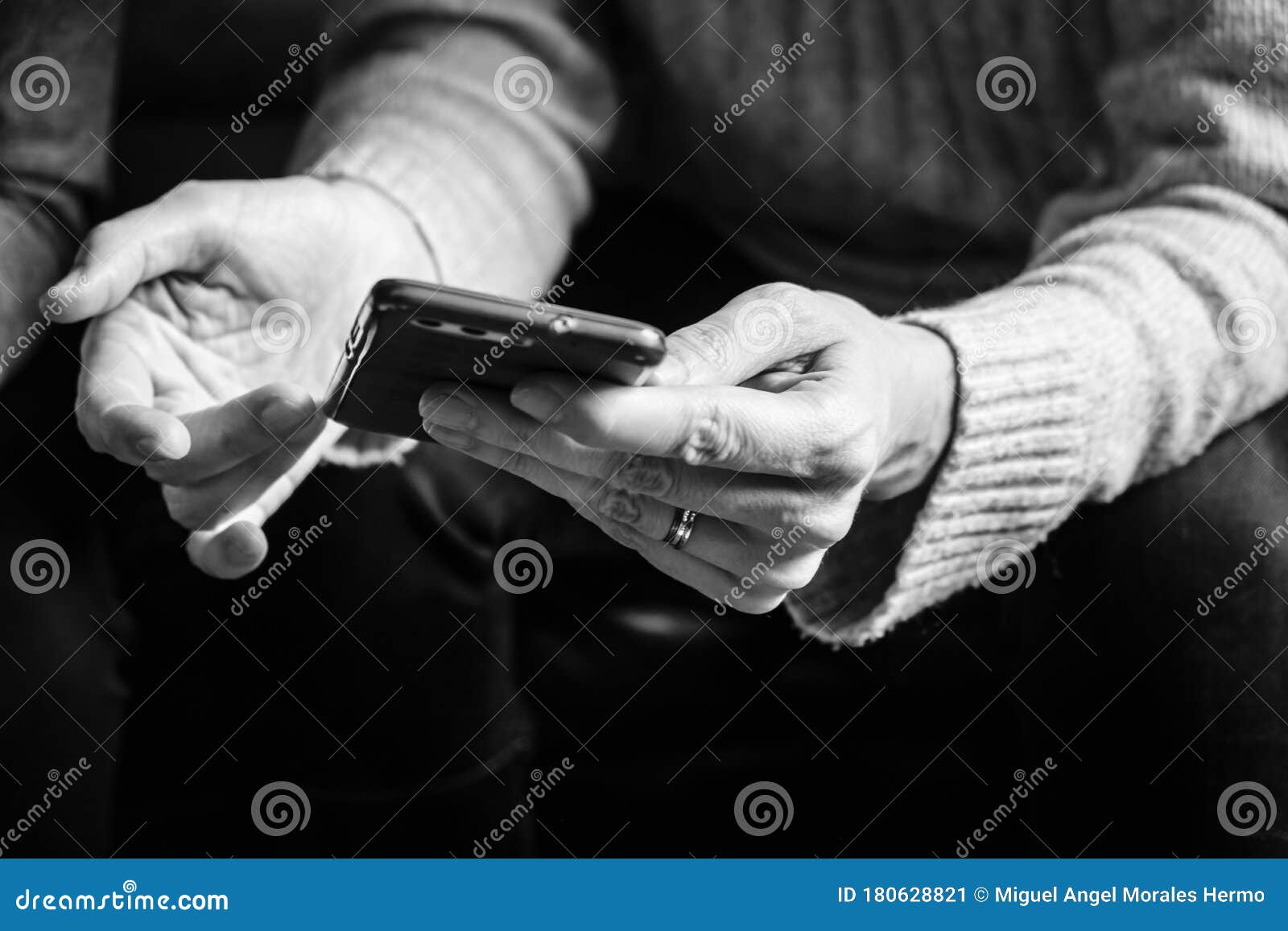 woman`s hands holding a smartphone