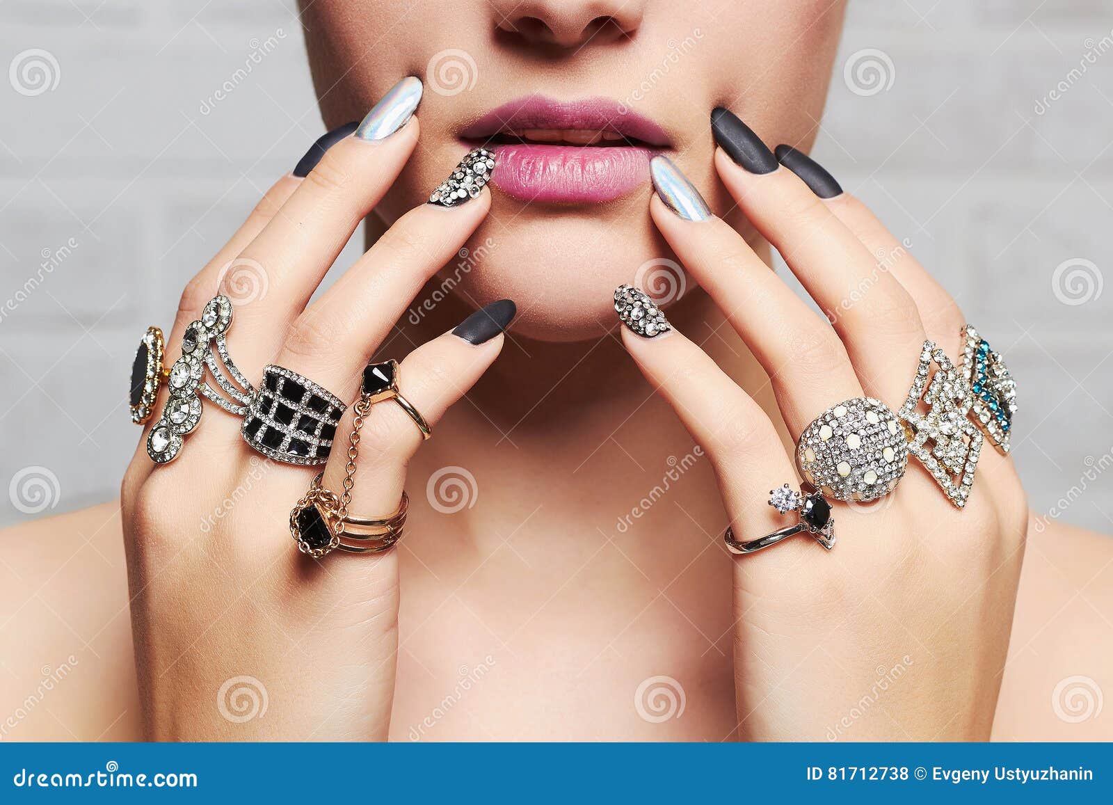 woman`s hands with jewelry rings