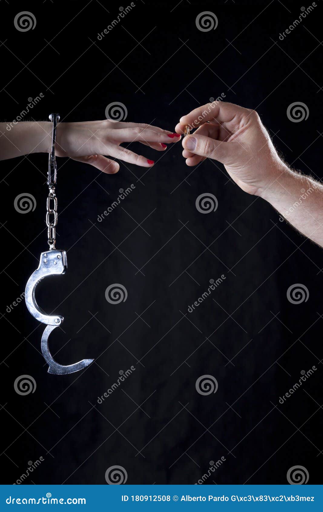Woman`s Hands with Married Ring and Handcuffs Stock Photo Image of