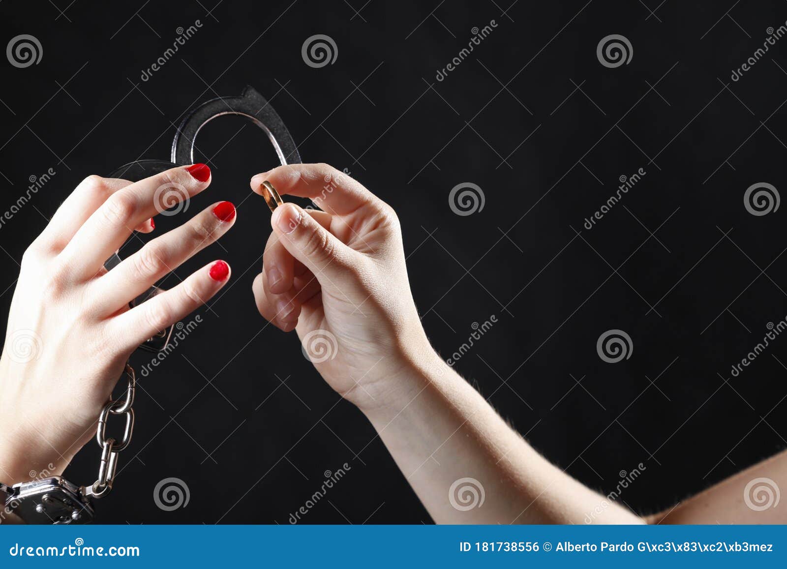 Woman`s Hands with Married Ring and Handcuffs Stock Photo Image of