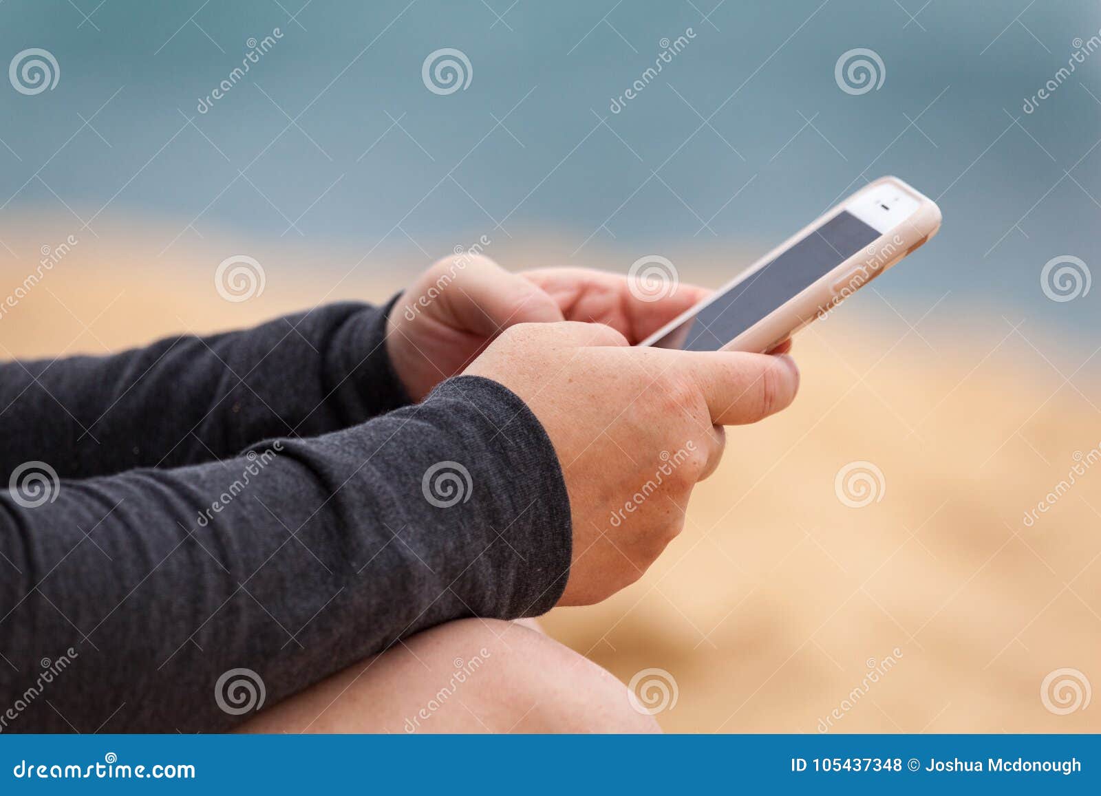 woman`s hands with smartphone texting