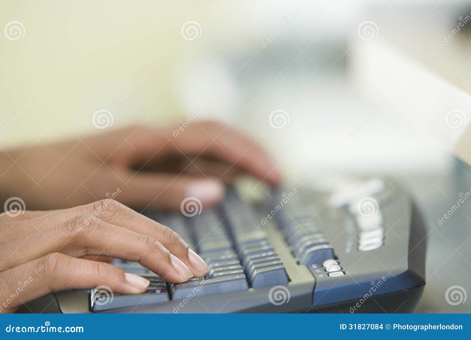 woman's hands typing on a computer keyboard