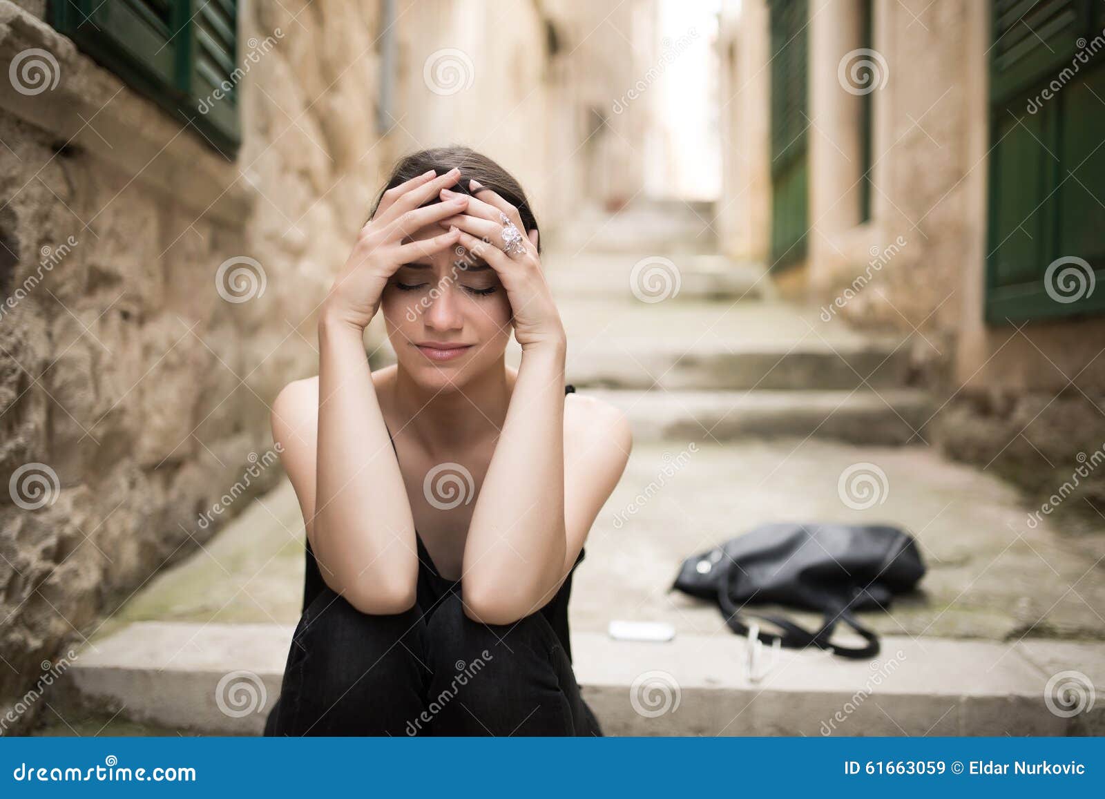 woman with sad face crying.sad expression,sad emotion,despair,sadness.woman in emotional stress and pain.woman sitting alone on th