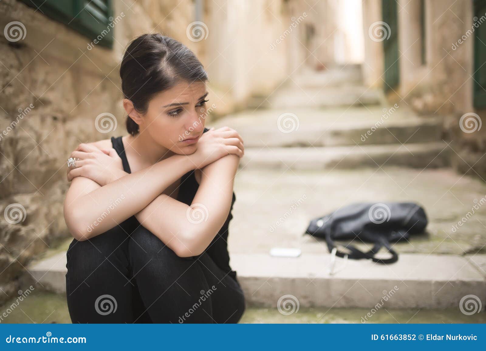 woman with sad face crying. sad expression, sad emotion, despair, sadness. woman in emotional stress and pain. woman sitting alone