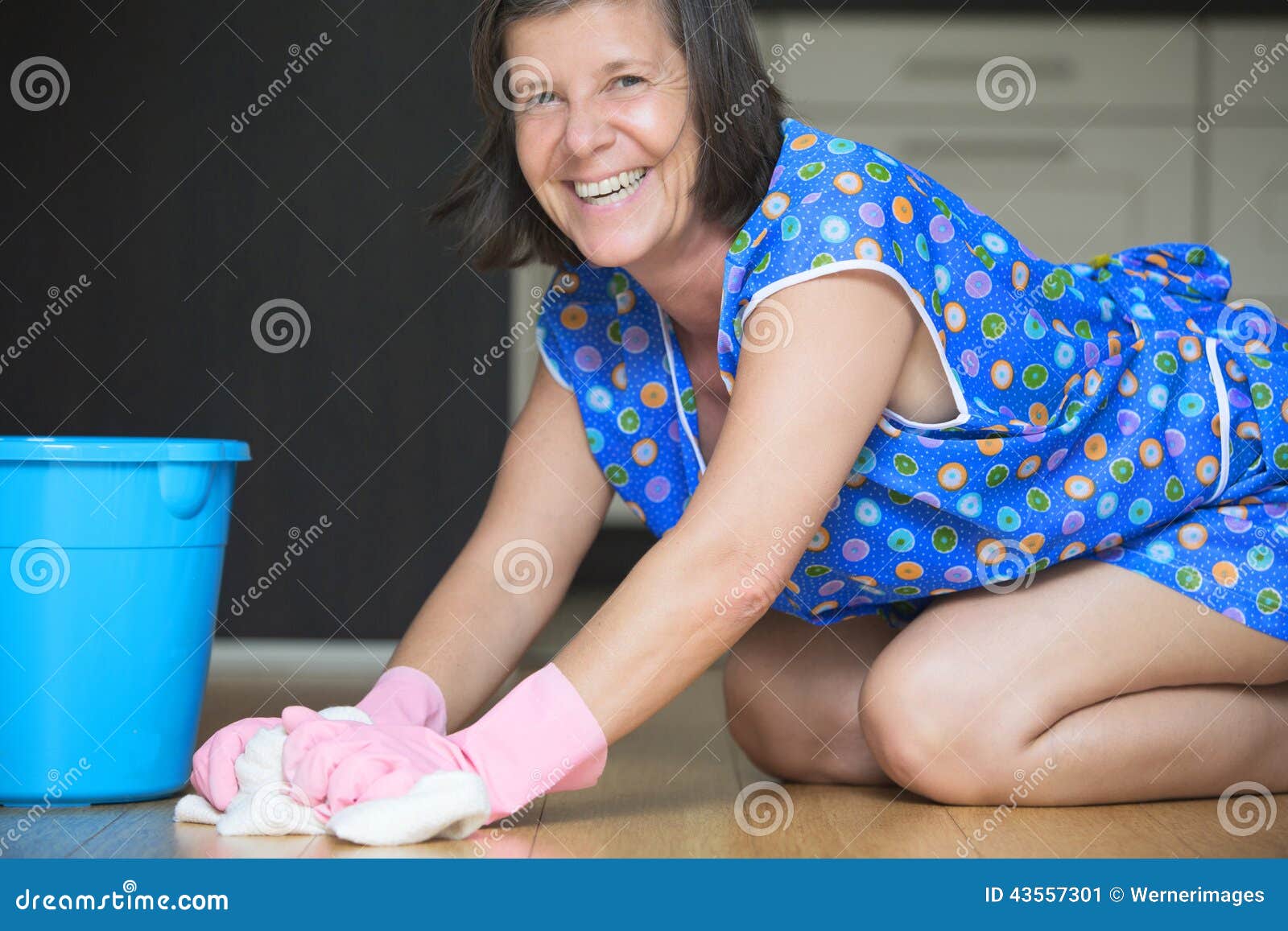 Woman Scrubbing The Floor Stock Image 43557301