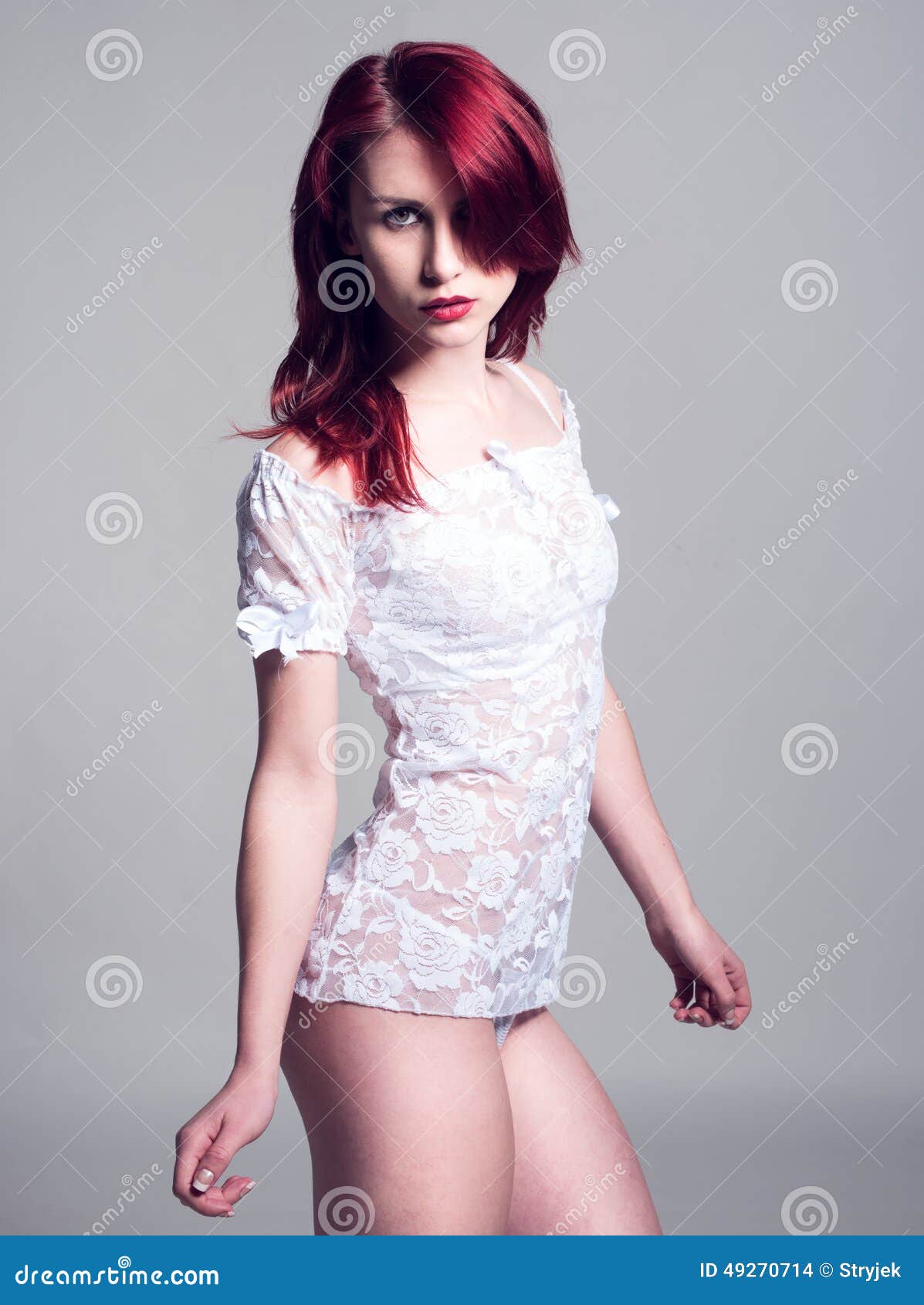 Woman in See through White Shirt Looking at Camera Stock Photo