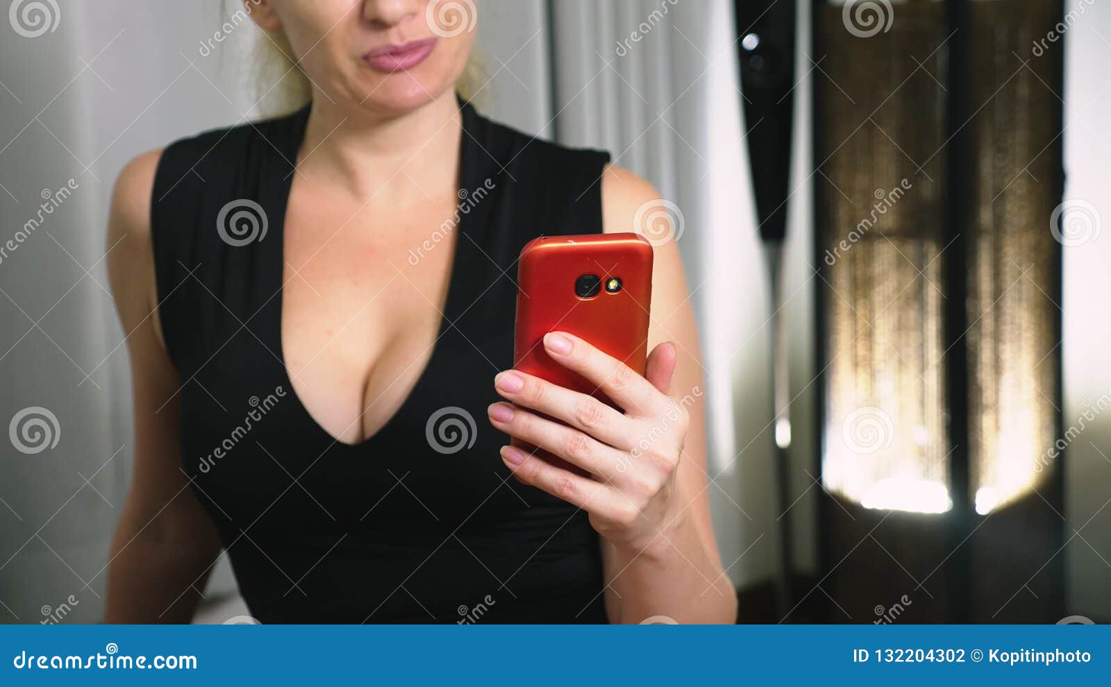 Woman Flirts Talking on Video Communication from Her Smartphone picture