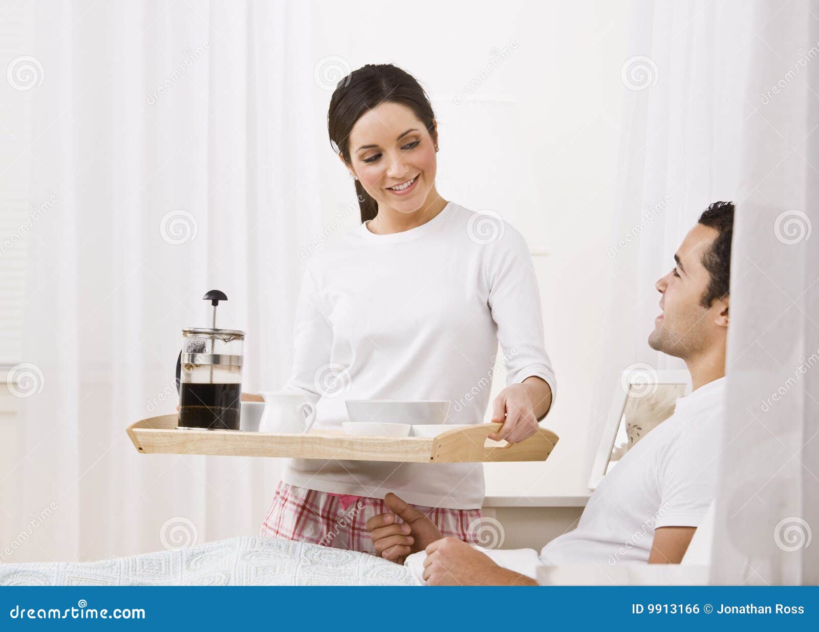 Woman Serving Breakfast Tray To Man Stock Photo - Image of female, hair