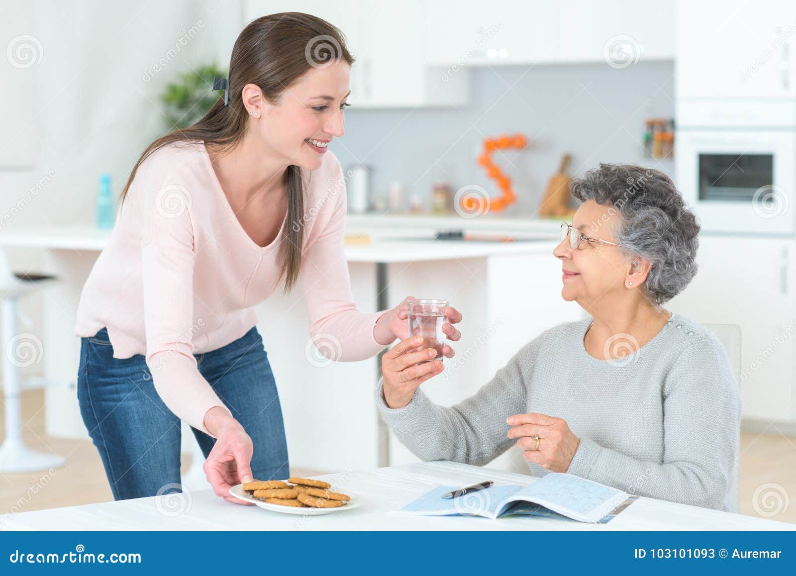 Woman Serving Old Woman with Water Stock Image - Image of caregiver ...