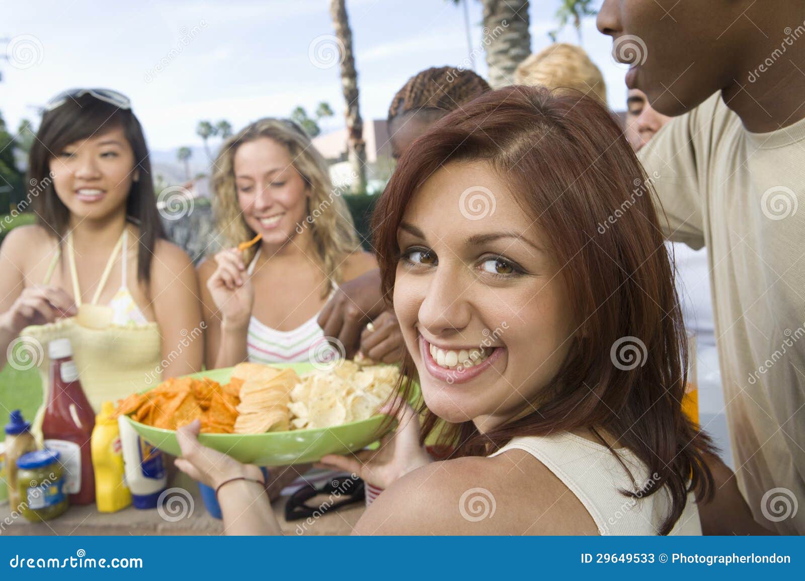 Woman Serving Snacks To Friends Stock Image Image of together