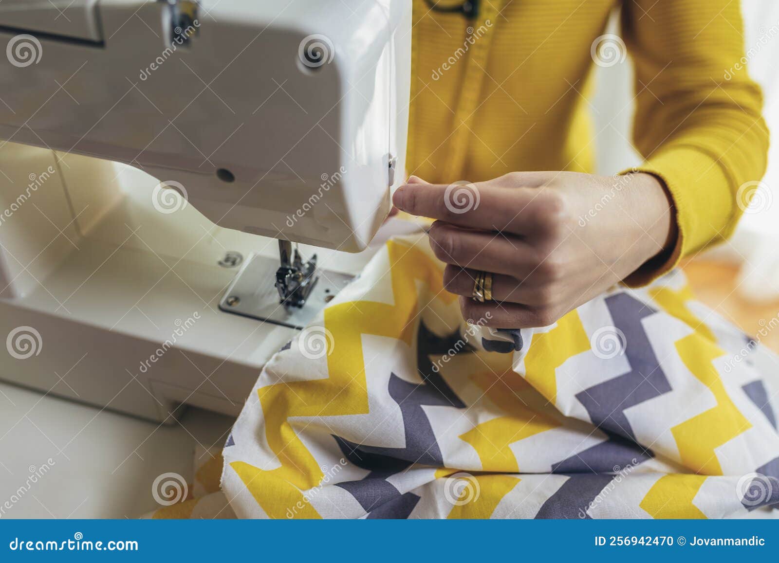 Woman Sewing on a Sewing Machine at Her Home Stock Photo Image of