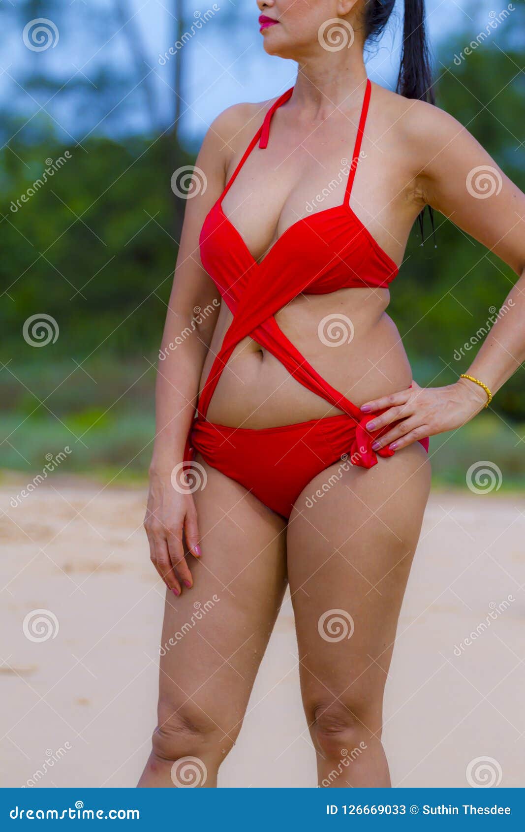Woman with Shape Sex Symbol in Sunshine on Beach Stock Image