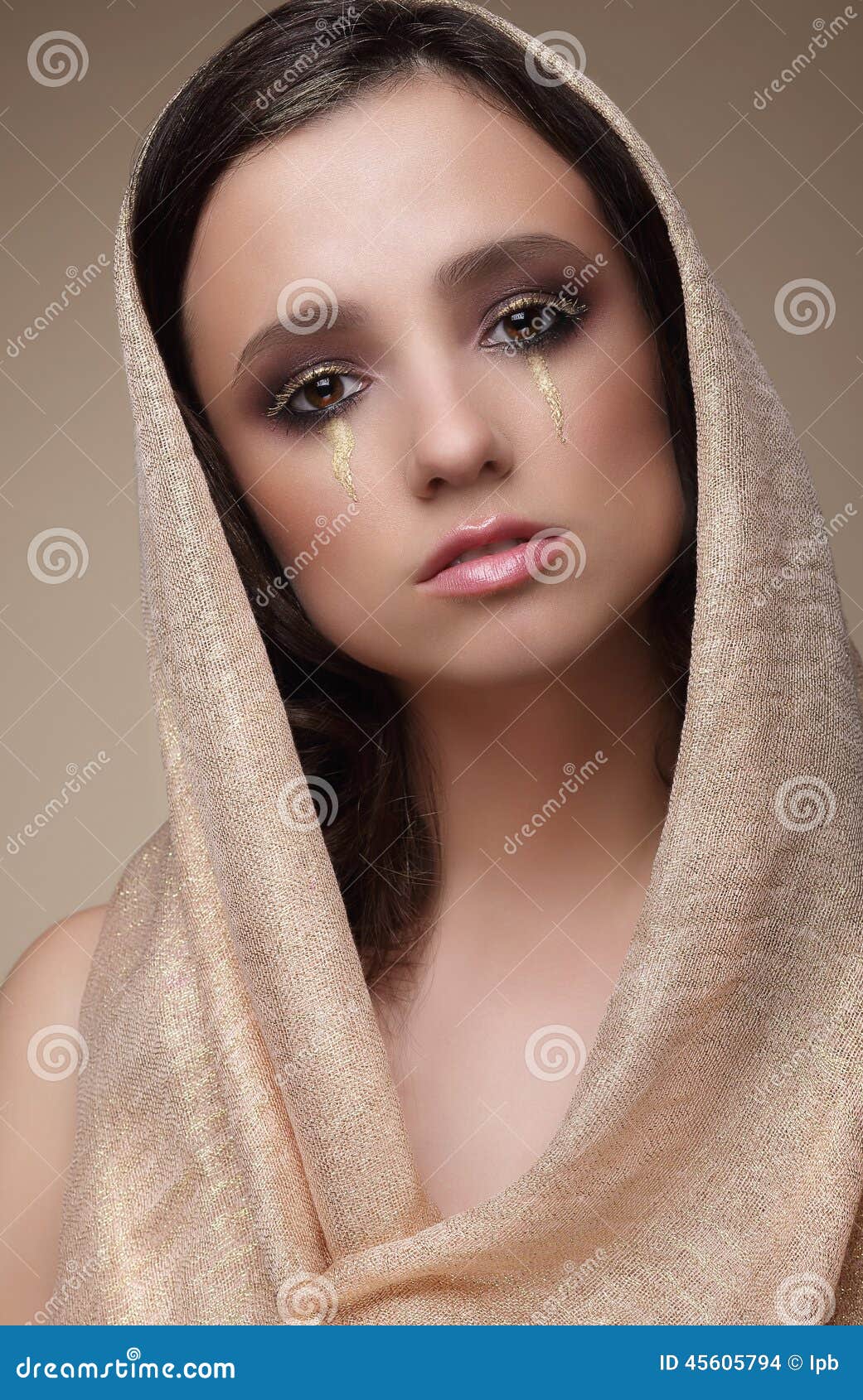woman in shawl with dramatic stagy makeup
