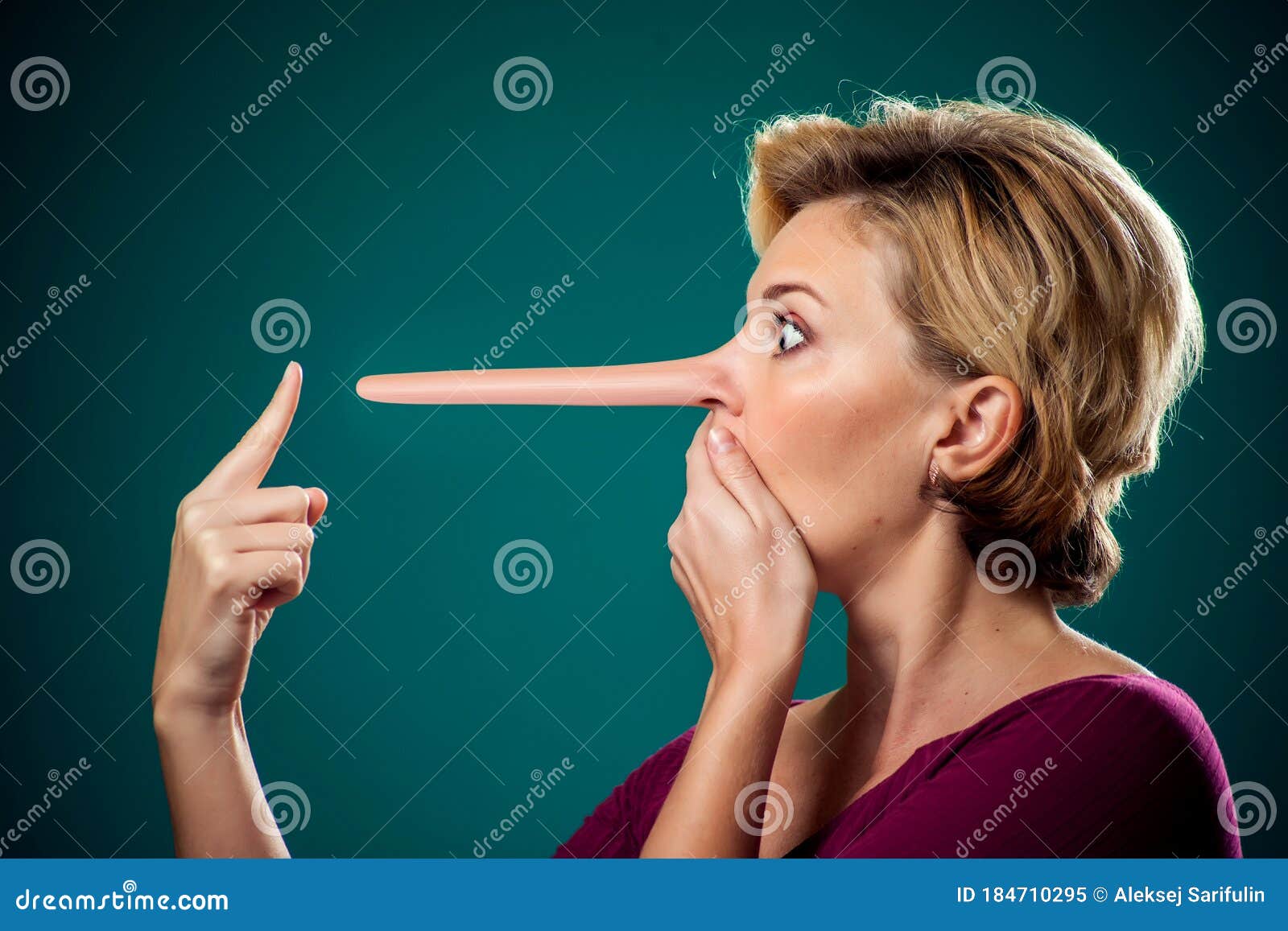 woman touching her long nose because of lie . people,lifestyle and emotions concept