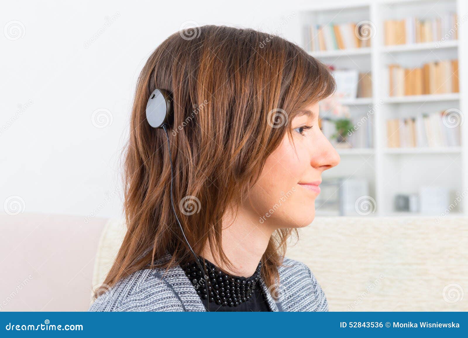 woman showing cochlear implant