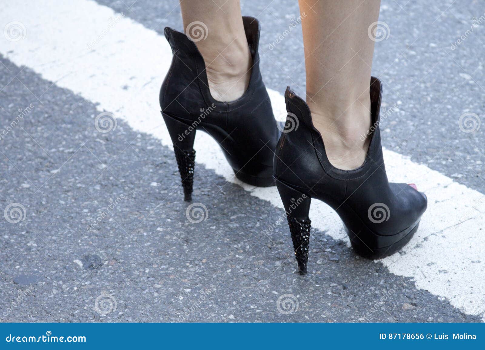 a woman showing her high heel booties