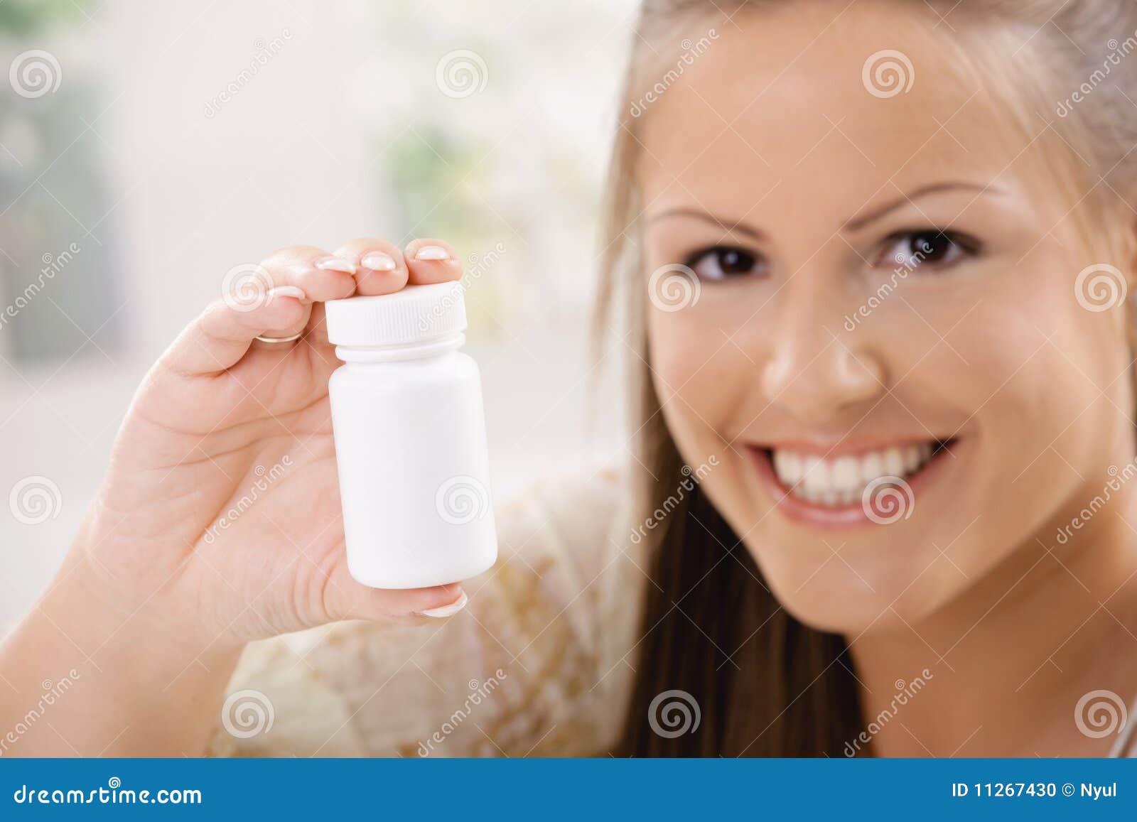 Woman showing pill bottle stock photo. Image of cure 11267430
