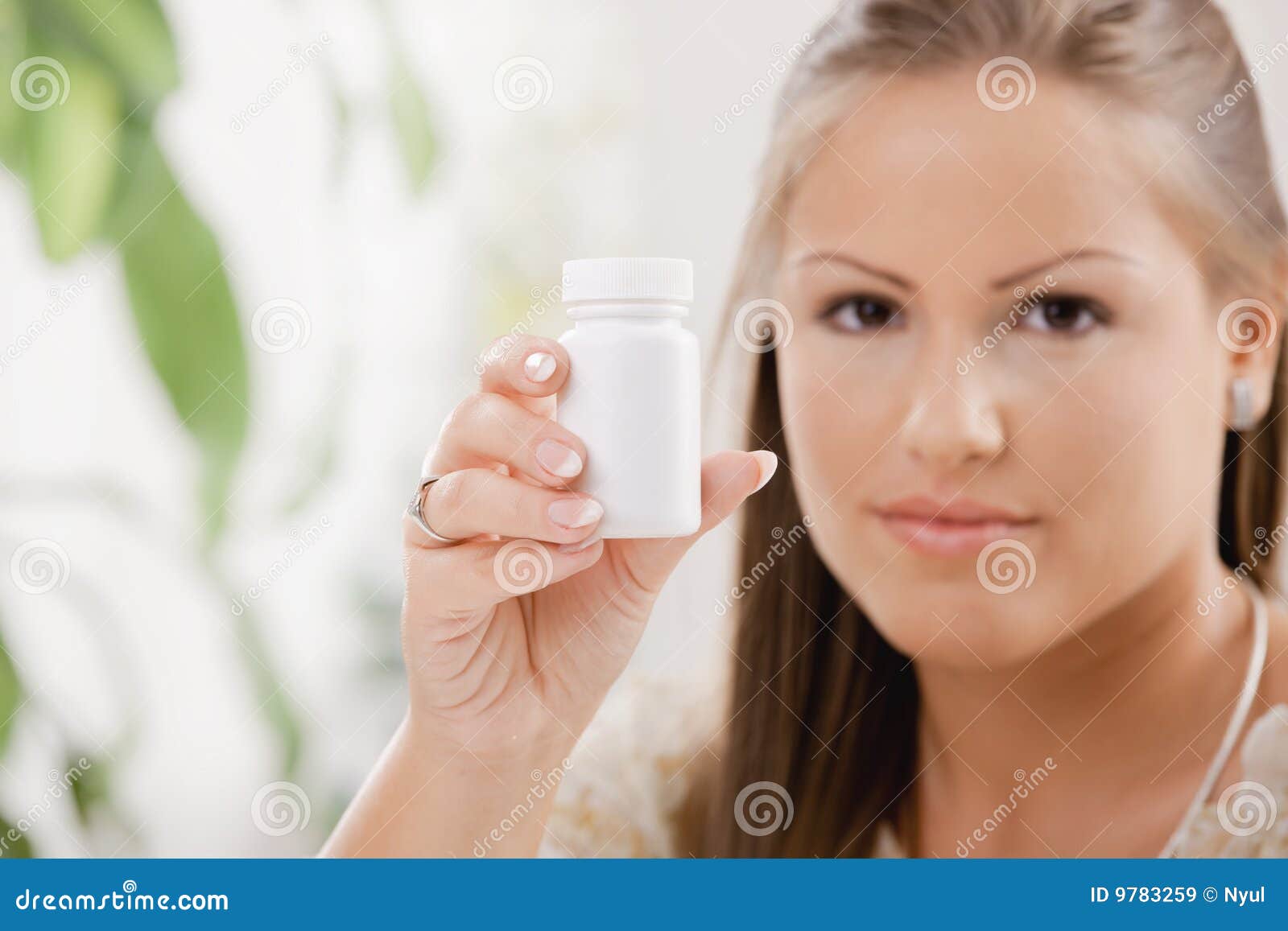 Woman showing pill bottle stock image. Image of casual 9783259