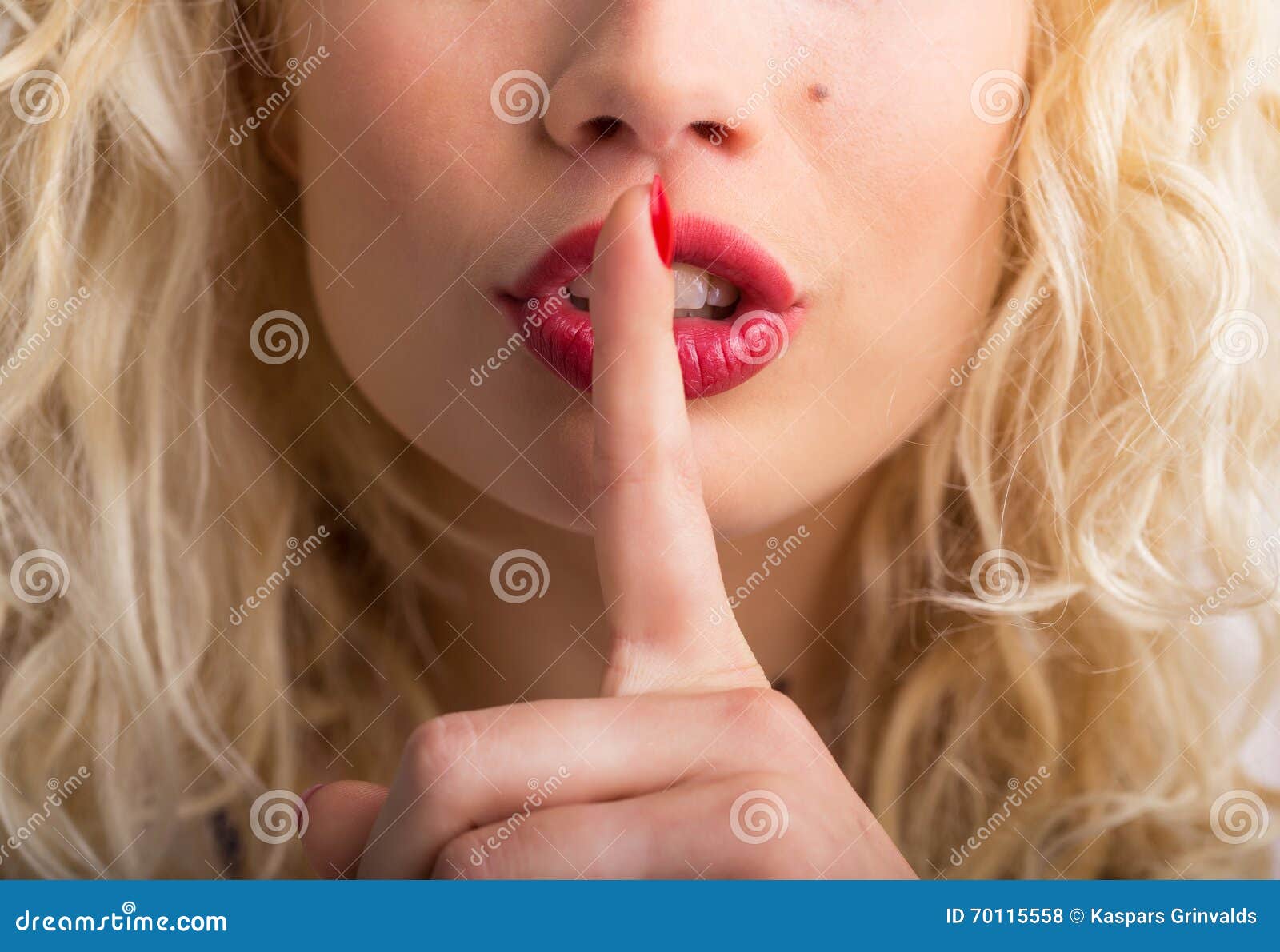 woman showing shh sign