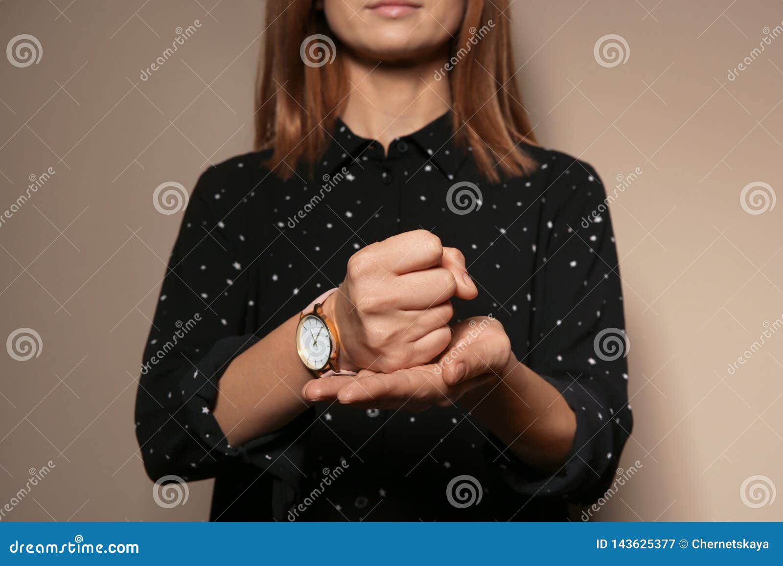 woman showing word crucify in sign language on color background