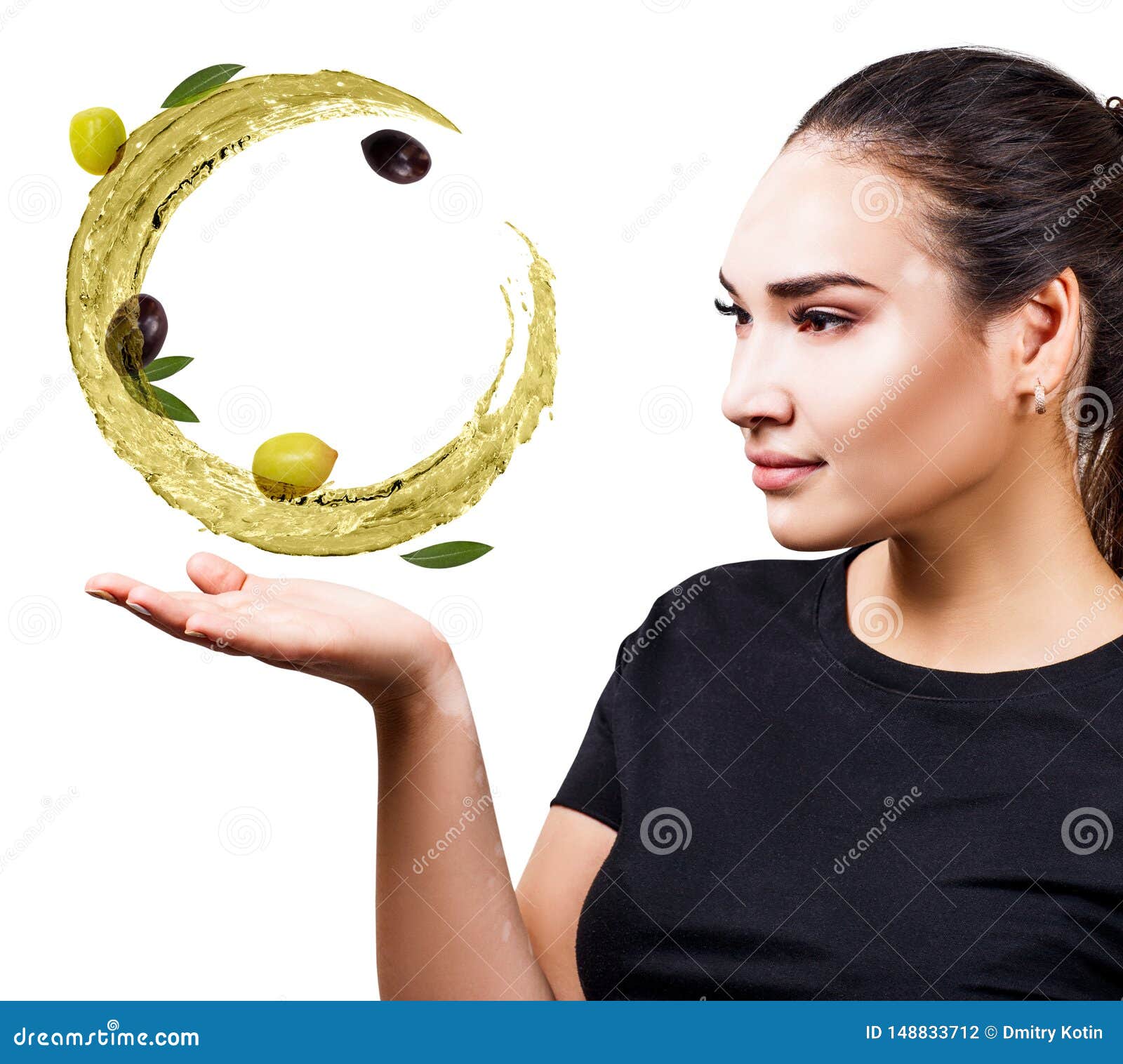 woman shows circulate splash of olive oil with olives in hand.