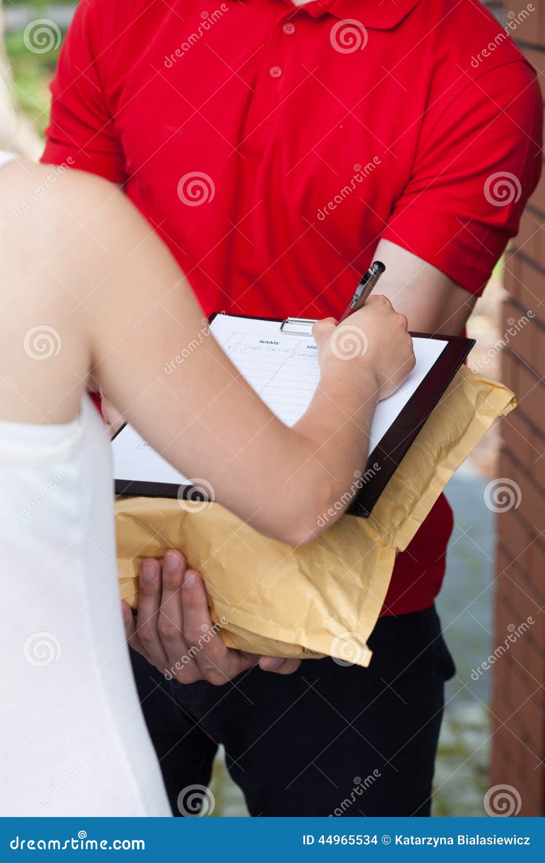 Woman Signing Package Delivery Papers Stock Photo Image of people