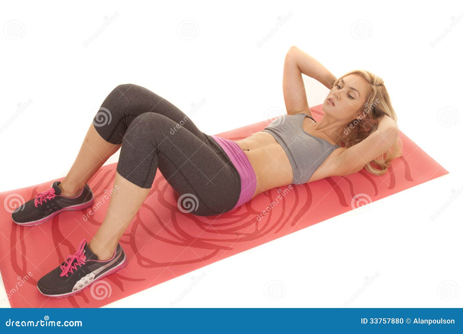 Woman sit up red yoga mat stock photo. Image of shape 33757880