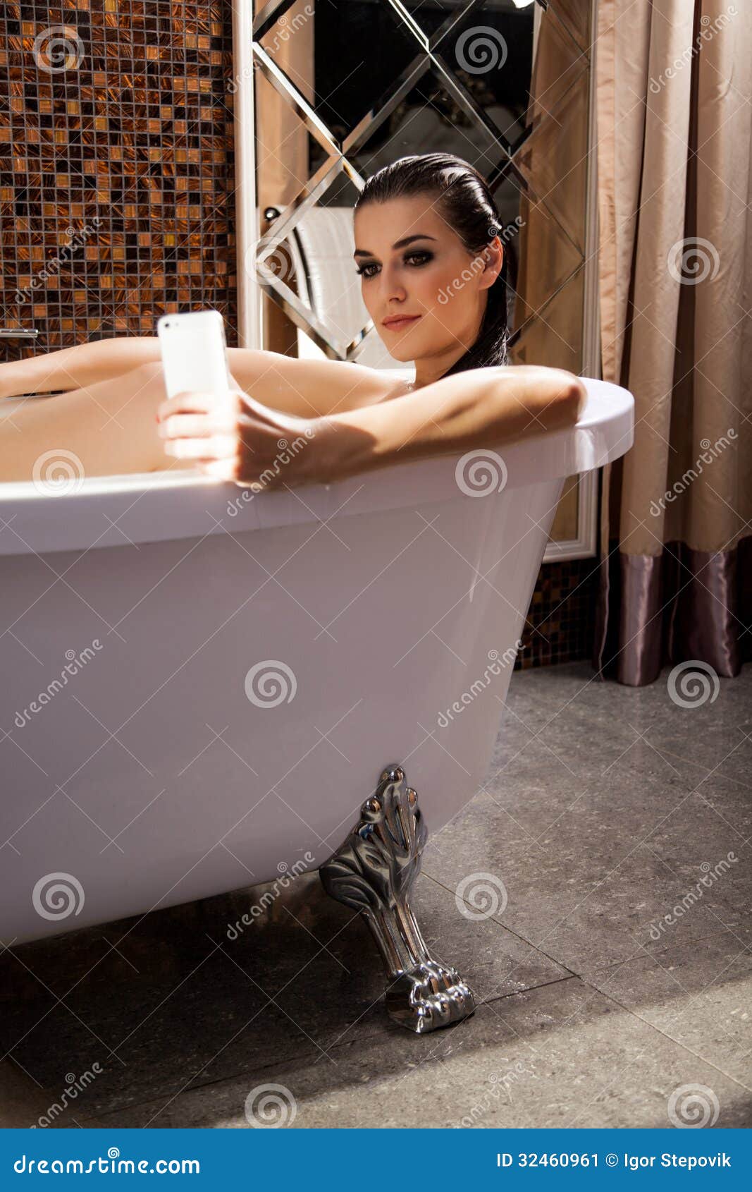 Woman Is Sitting In Bath And Have Videochat By Smartphone