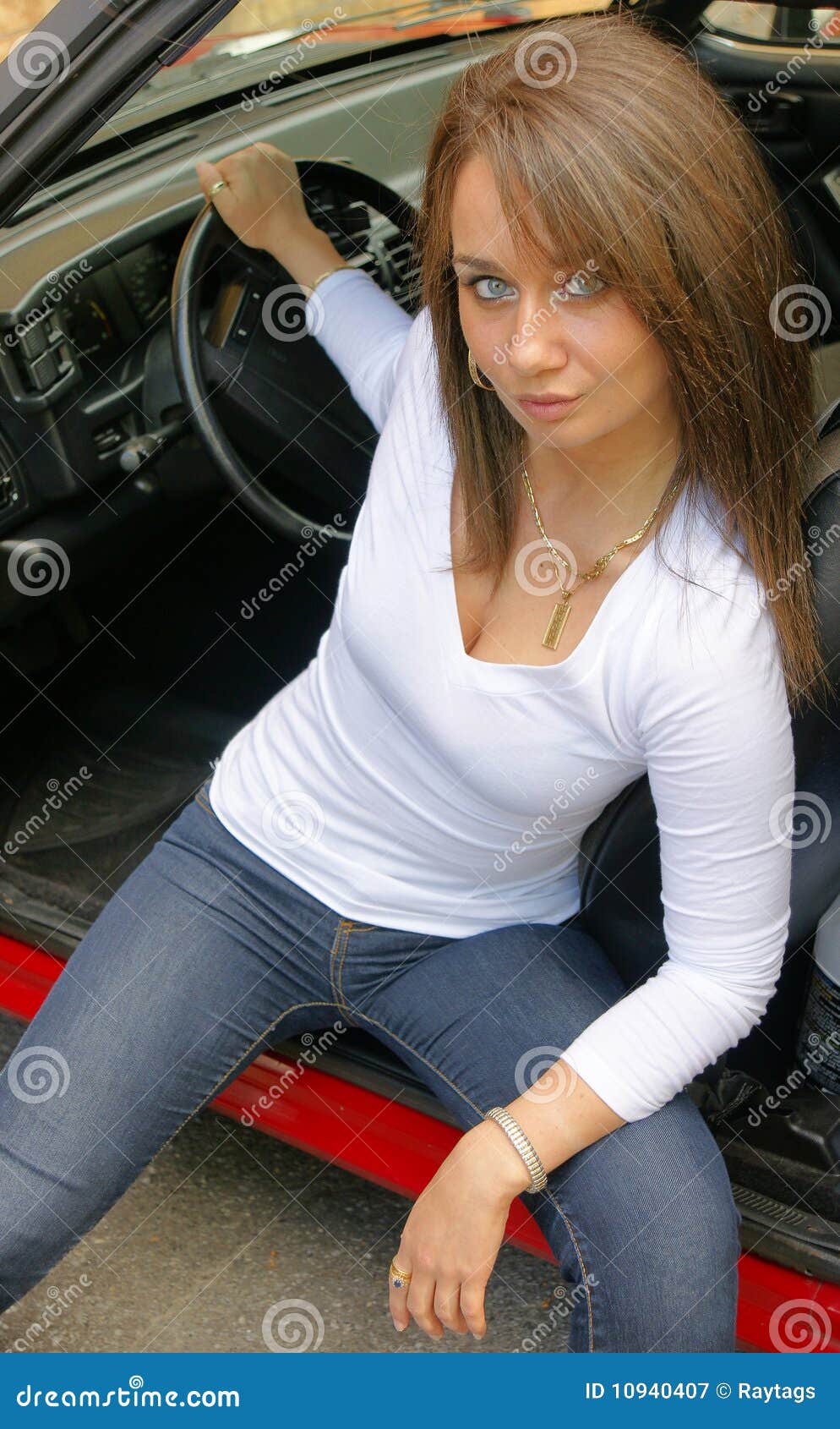 Woman sitting in a car and playing a Pokemon Go game Stock Photo - Alamy