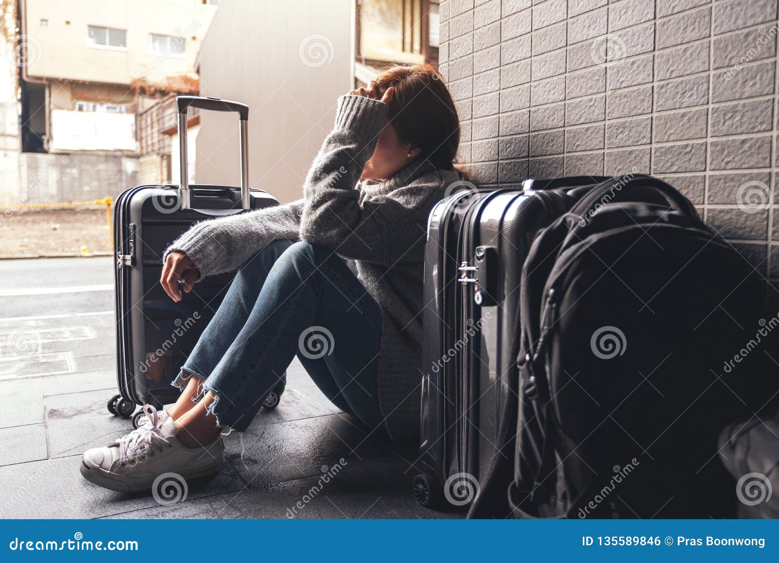 A Woman Sitting with Feeling Sad and Lost while Traveling Stock ...