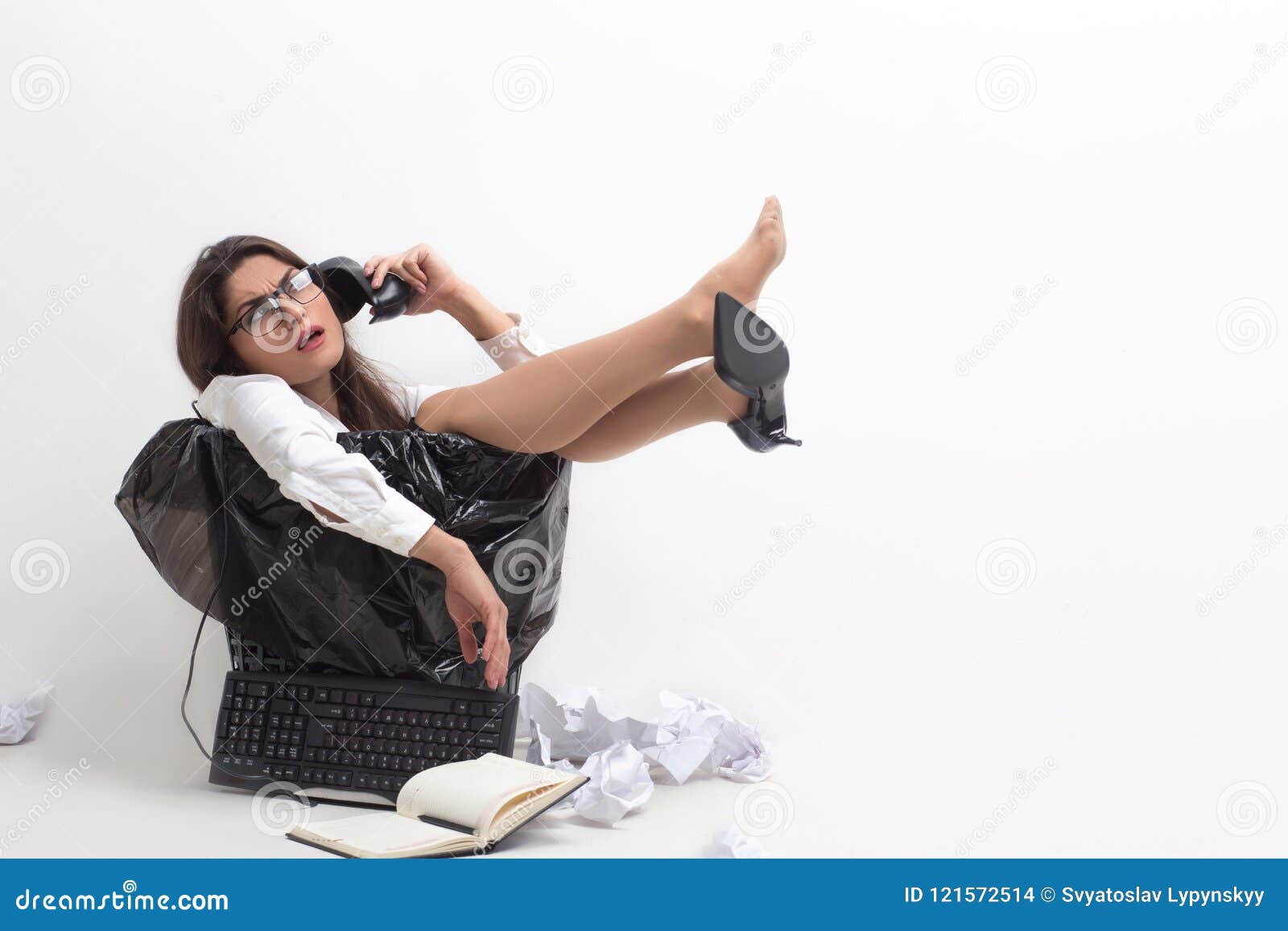 crazy woman sitting in trash can.